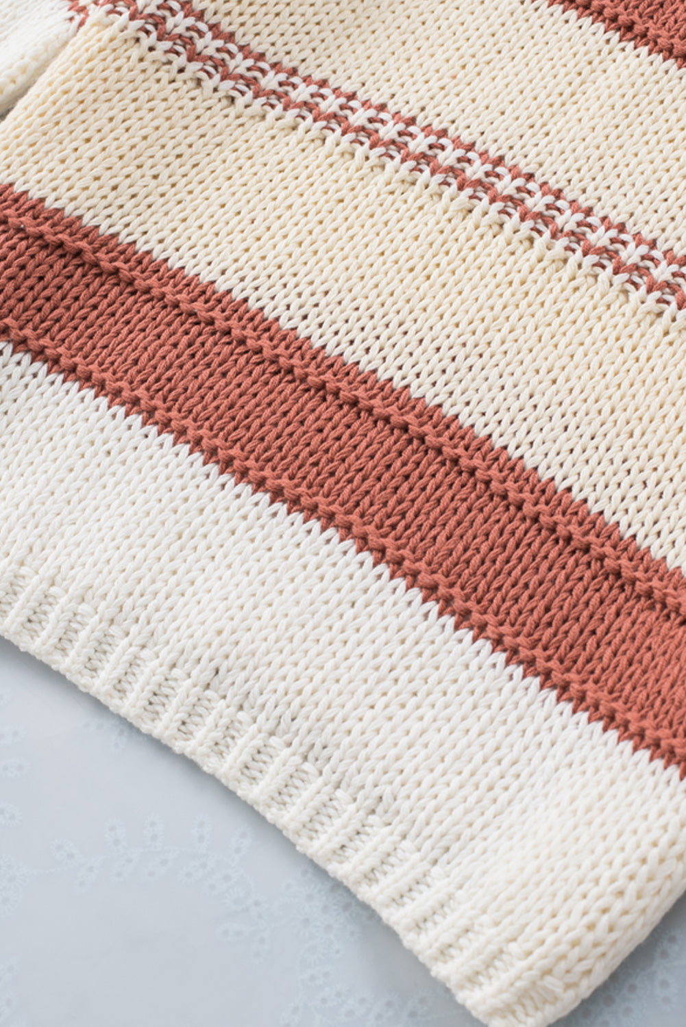 Orange turtleneck knit sweater with color block design and balloon sleeves, perfect for autumn and winter fashion.