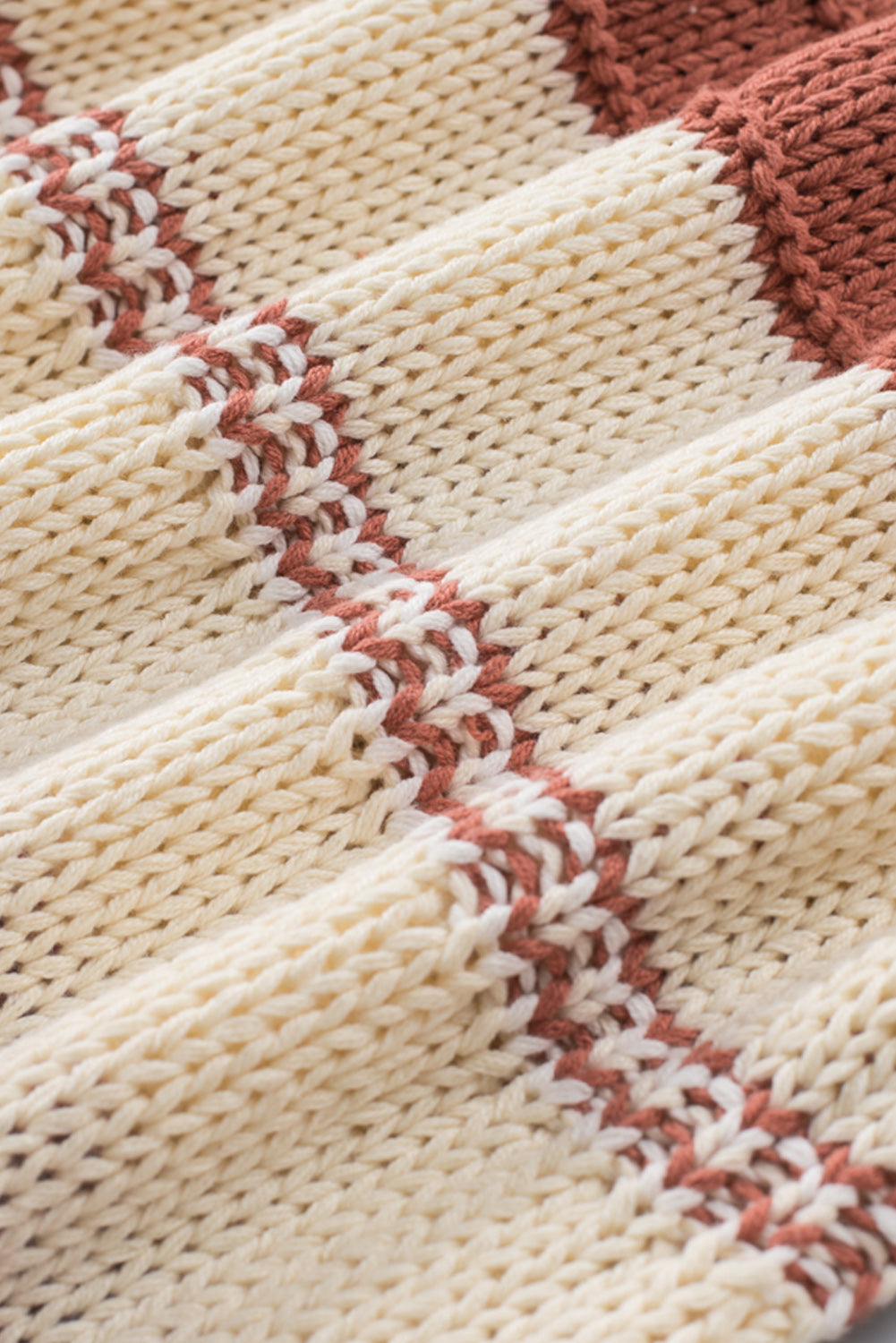 Orange turtleneck knit sweater with color block design and balloon sleeves, perfect for autumn and winter fashion.