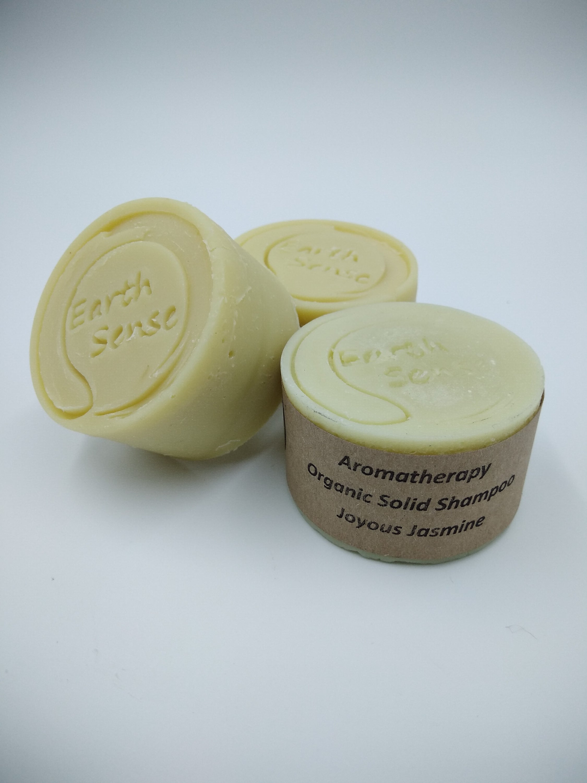 Organic Certified Balancing Solid Shampoo bar with Jasmine, suitable for normal and all hair types, displayed on a natural background.