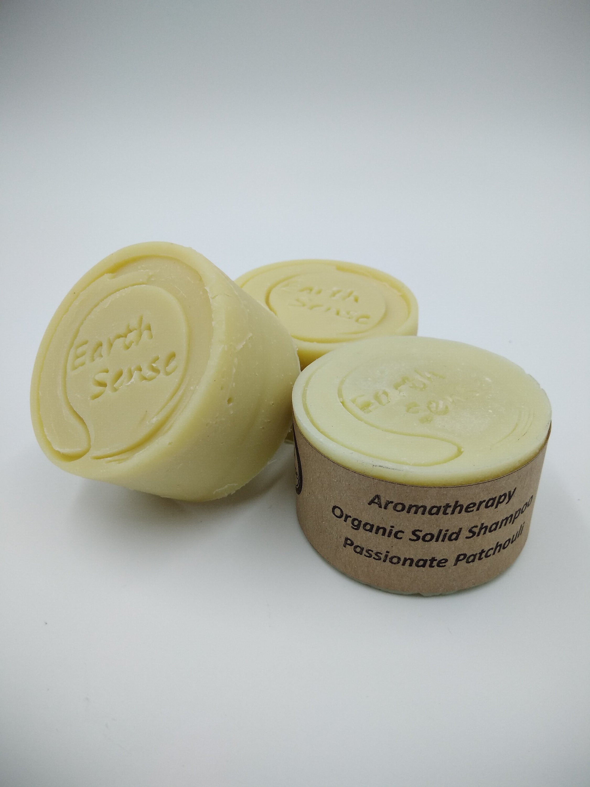 Organic Certified Balancing Solid Shampoo bar with Patchouli, ideal for oily and all hair types, showcasing its natural ingredients.