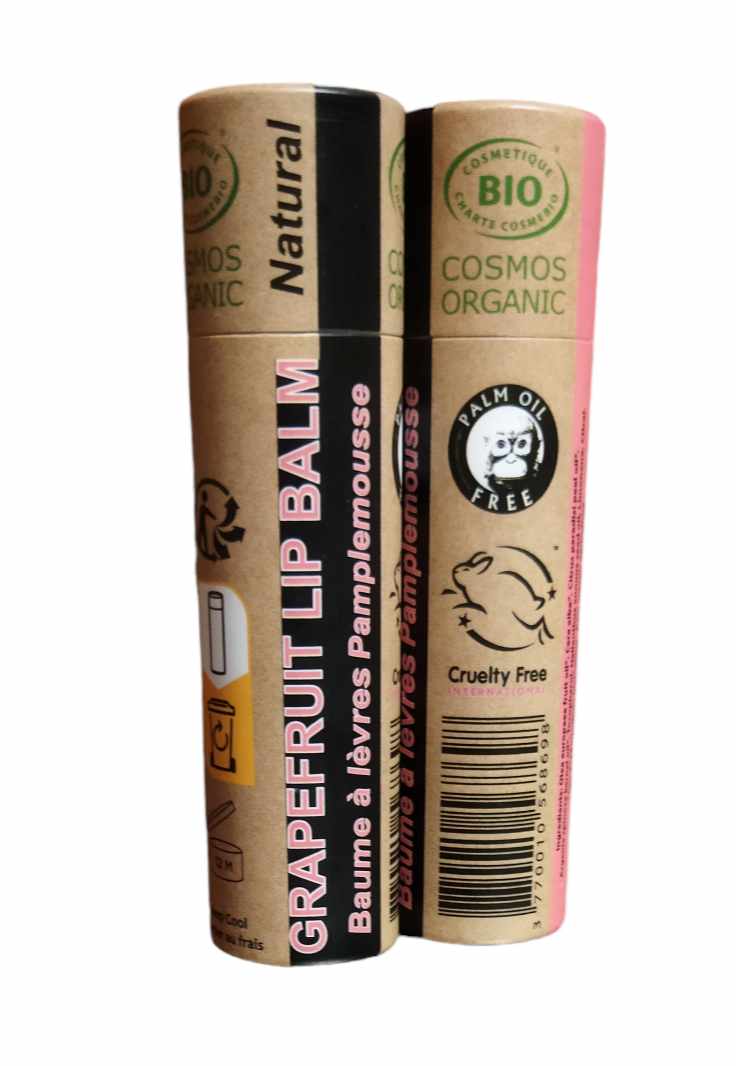 Organic Pink Grapefruit Lip Balm in a paper tube, showcasing its natural ingredients and eco-friendly packaging.
