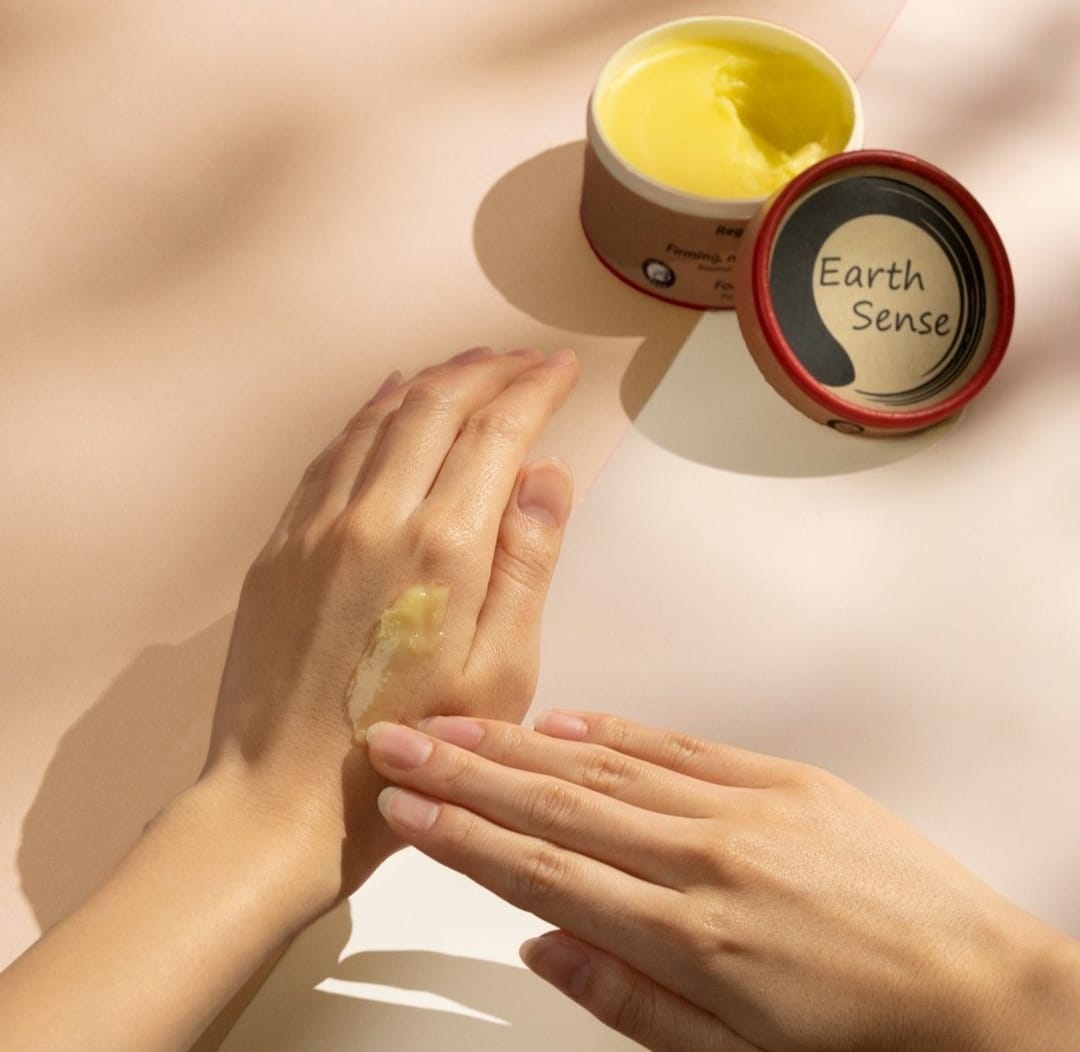 Organic Regenerating Body Balm with Ylang Ylang in a 100ml container, showcasing its natural ingredients and eco-friendly packaging.