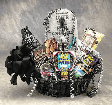 Over the Hill Birthday Gift Basket featuring a tombstone, cookies, a mug, and themed candies in a black gift box.