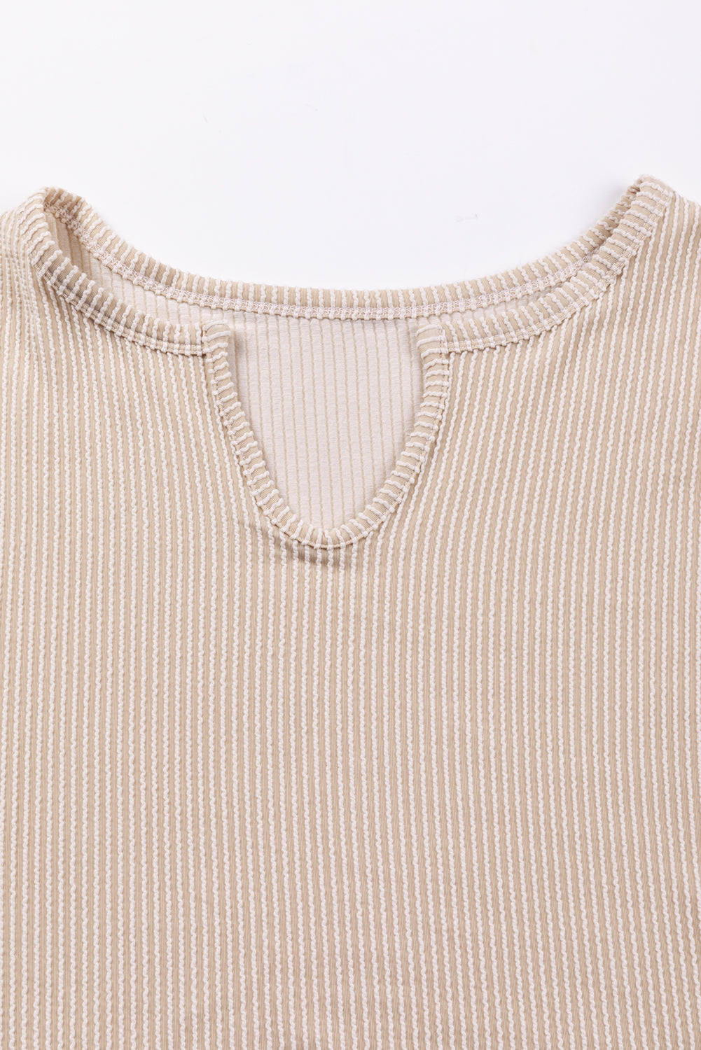 Parchment Corduroy Patchwork Drop Shoulder V Neck Top featuring textured patch sleeves and a relaxed fit.