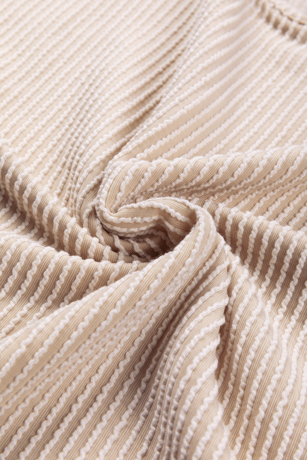 Parchment Corduroy Patchwork Drop Shoulder V Neck Top featuring textured patch sleeves and a relaxed fit.