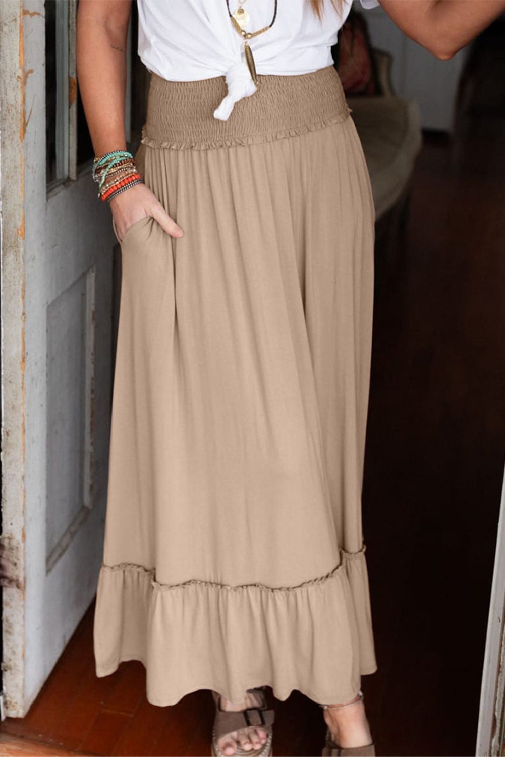 Parchment Smocked Waist Ruffled Maxi Skirt displayed on a mannequin, showcasing its elegant ruffled hem and smocked waist design.