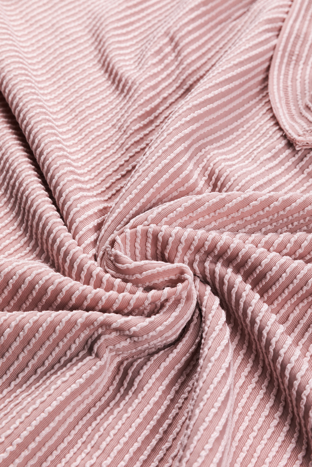 Peach Blossom Loose V Neck Bubble Sleeve Knit Ribbed Top showcasing a feminine silhouette with bubble sleeves and a soft ribbed texture.