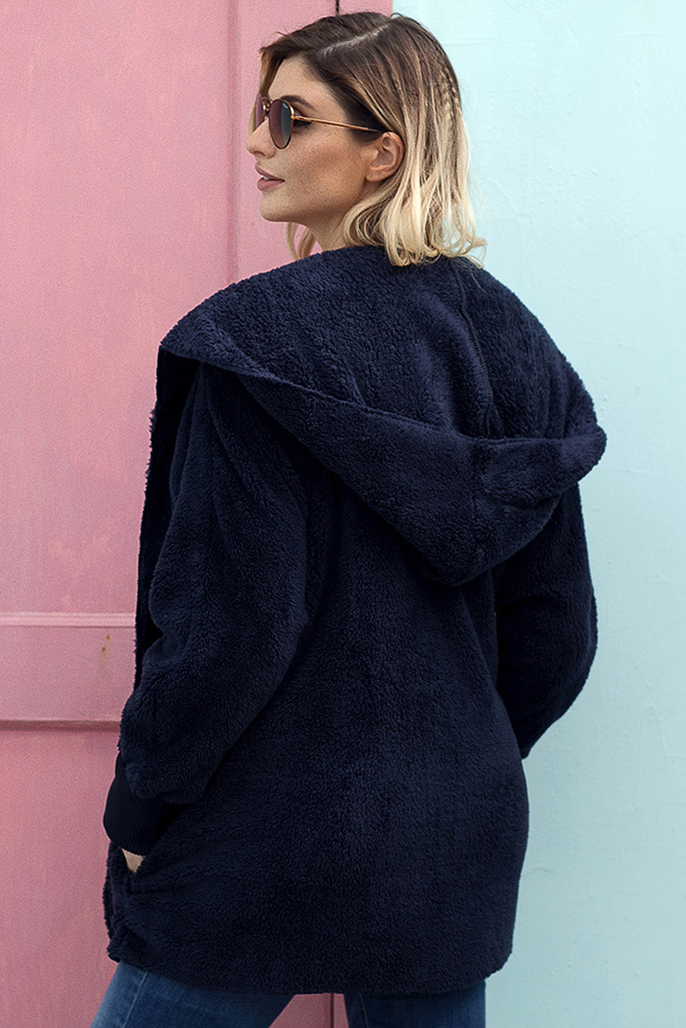 A stylish pink soft fleece hooded open front coat with ribbed sleeves and front pockets, perfect for fall wear.