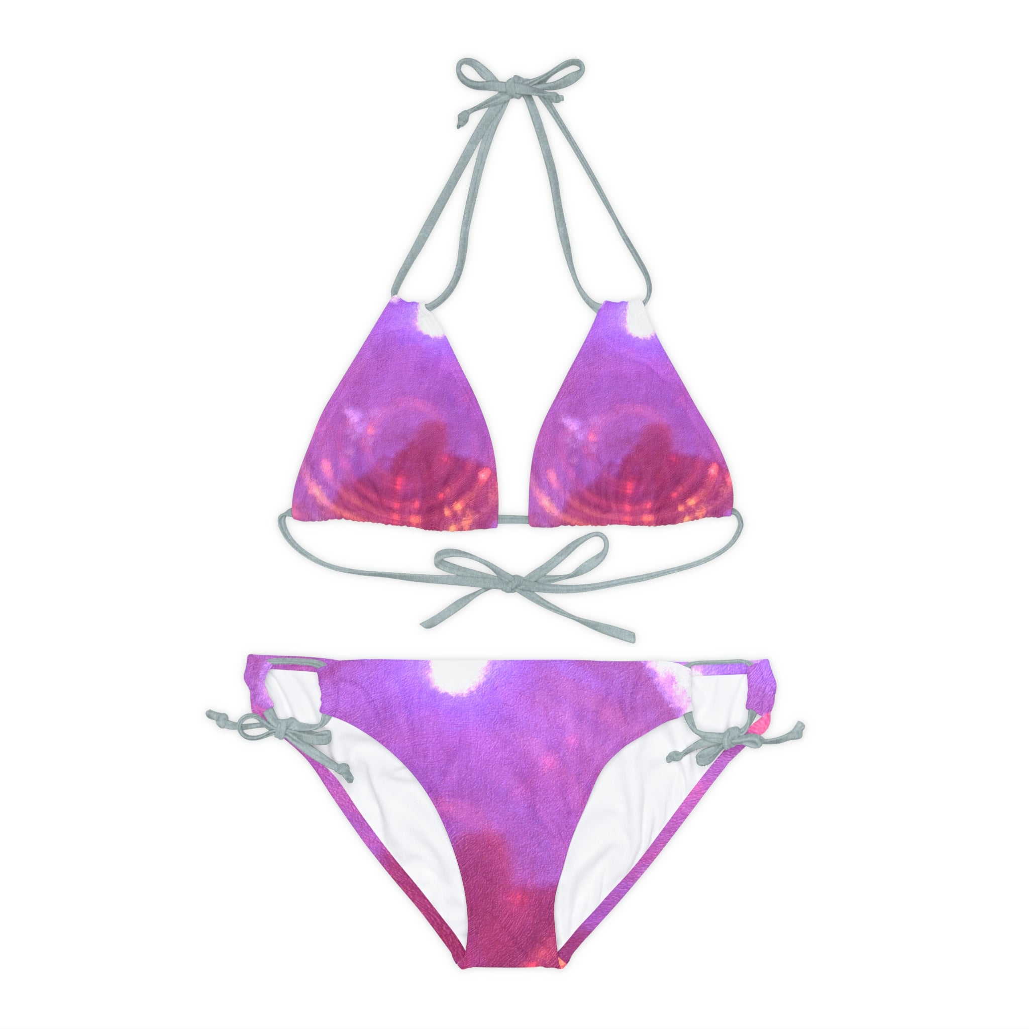 A stylish Pink Strappy Bikini Set featuring adjustable straps and removable cups, perfect for summer beach outings.