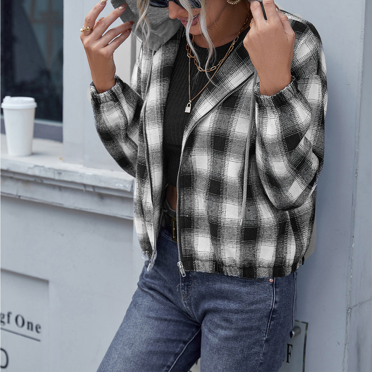 A stylish plaid drawstring zip up hooded jacket with elastic cuffs, showcasing its trendy design and comfortable fit.