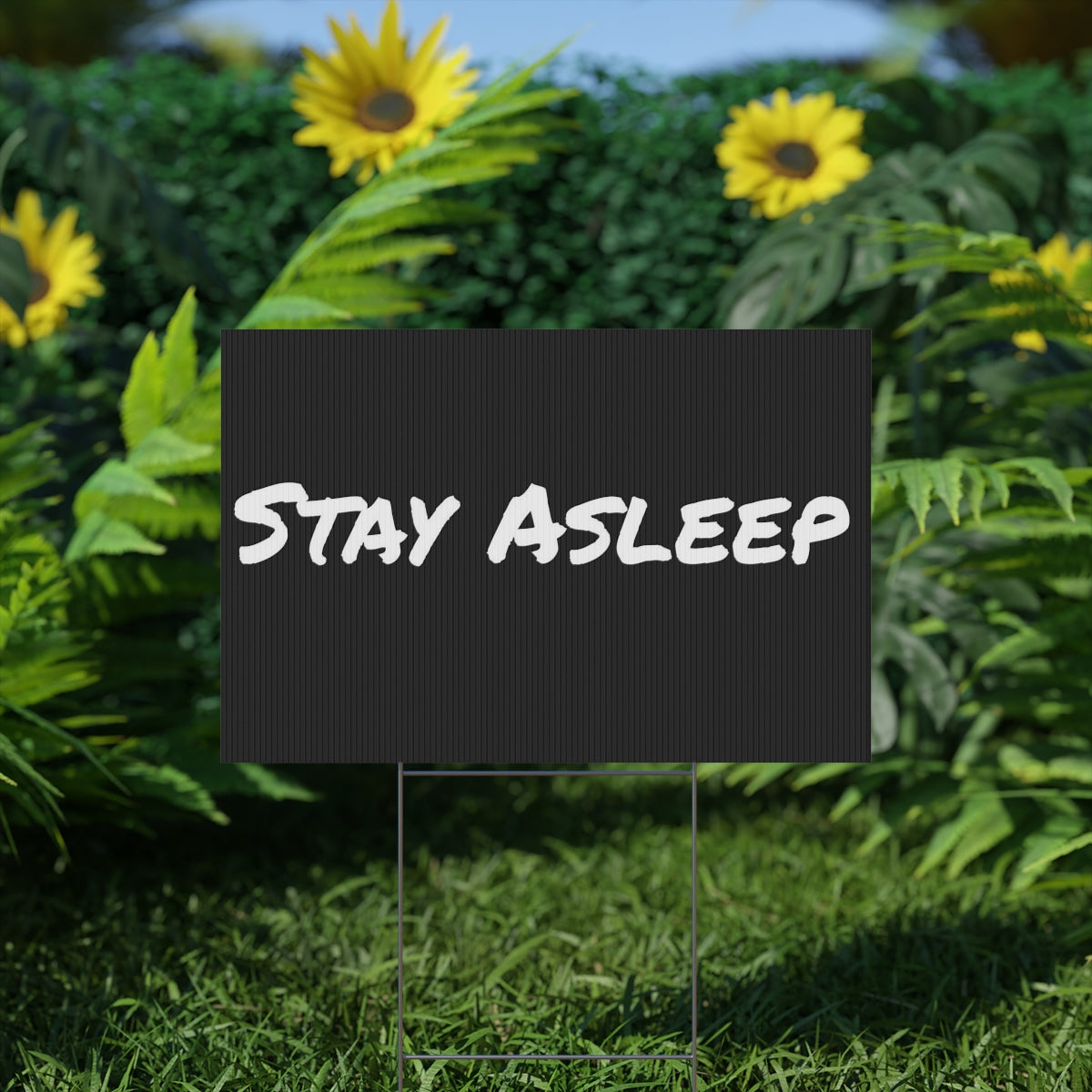 A vibrant plastic yard sign displayed outdoors, showcasing custom artwork with an aluminum stake for easy installation.