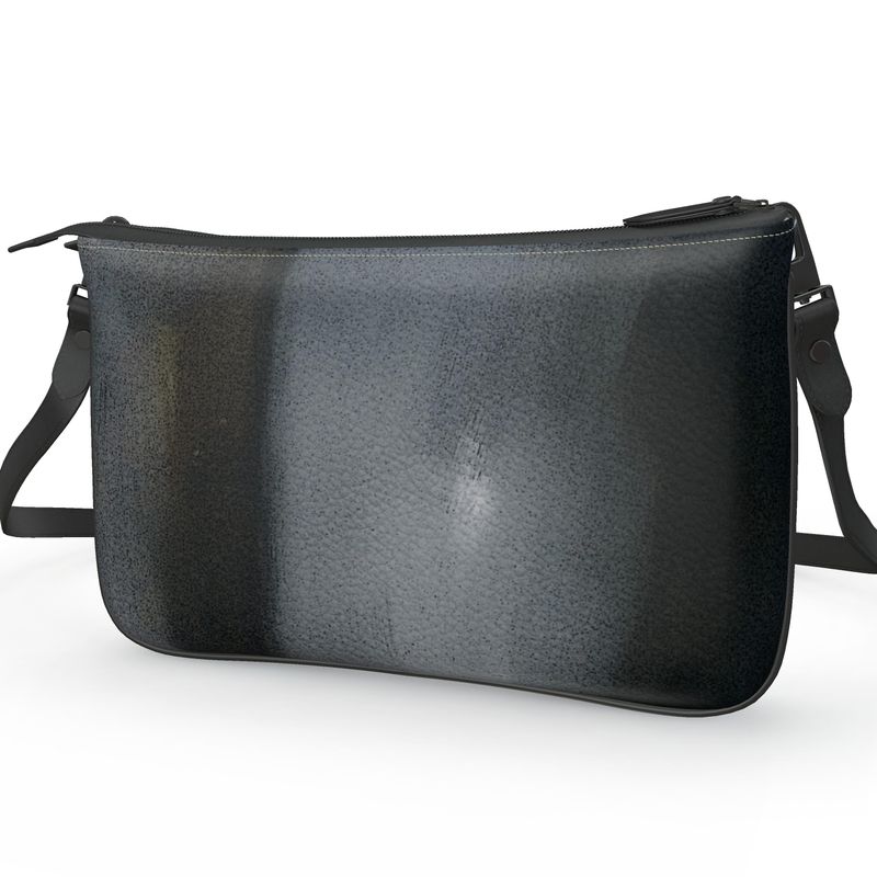 Pochette Double Zip Bag made from 100% Nappa leather with faux suede lining, featuring a clip and chain strap option.