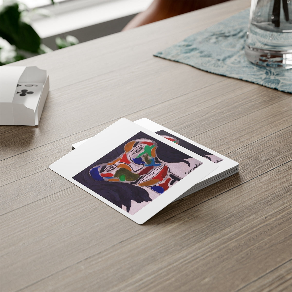 A set of personalized poker cards featuring a glossy finish, durable 300gsm paper, and a customizable back design, neatly packaged in a white box.