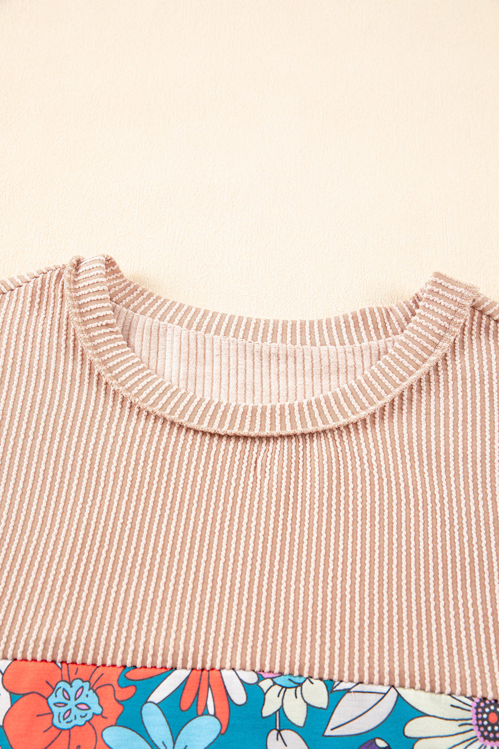 A stylish Printed Floral Contrast Colorblock Ribbed Top featuring vibrant floral patterns and ribbed fabric, perfect for casual or dressy occasions.
