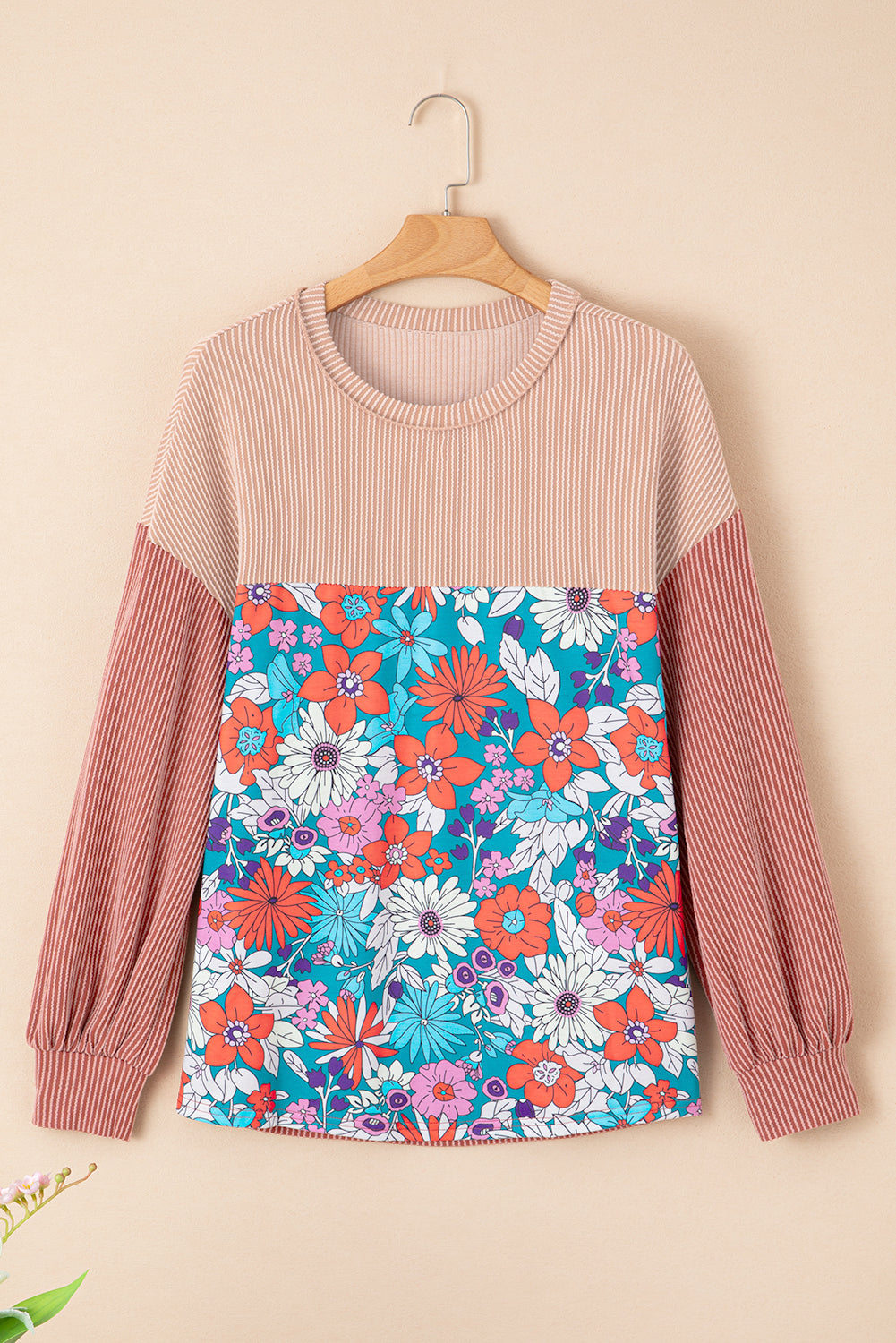 A stylish Printed Floral Contrast Colorblock Ribbed Top featuring vibrant floral patterns and ribbed fabric, perfect for casual or dressy occasions.