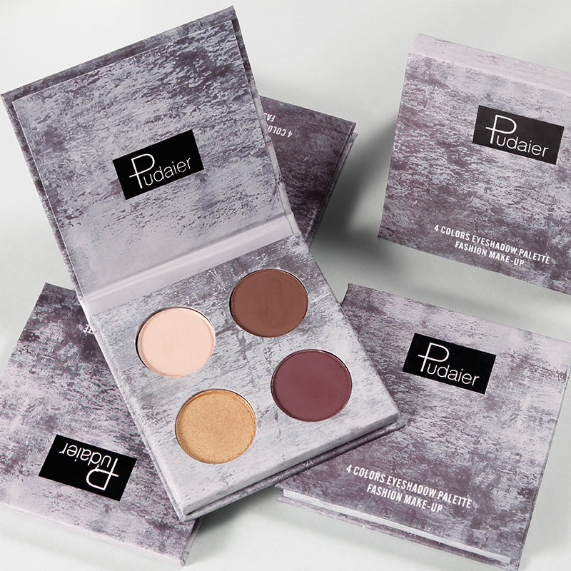 Pudaier Ink Landscape Four-color Eyeshadow Palette showcasing four vibrant shades in matte and pearlescent finishes, perfect for versatile eye looks.