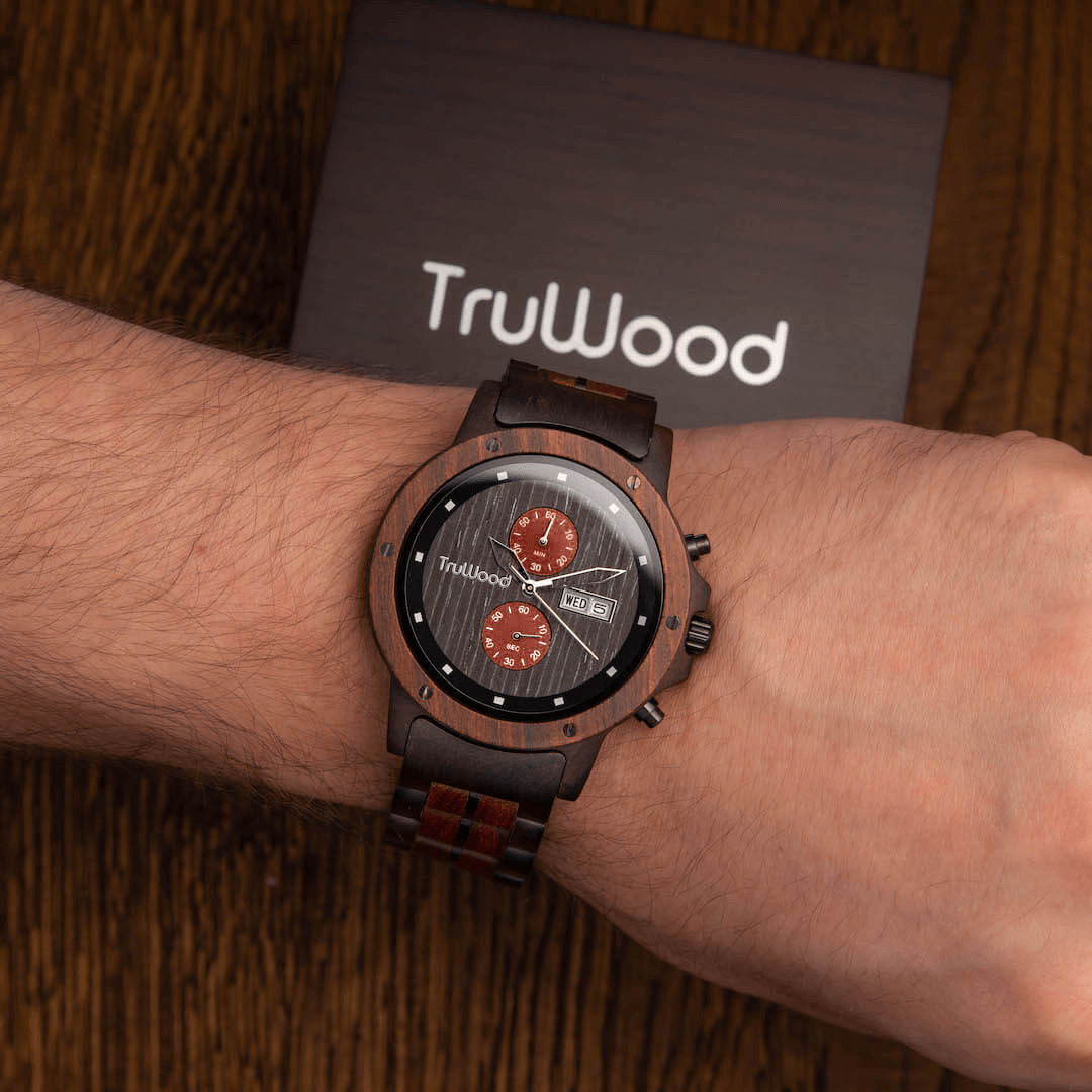 Ragna Wrist Watch featuring a red sandalwood bezel and black stainless steel band, showcasing its unique design and craftsmanship.