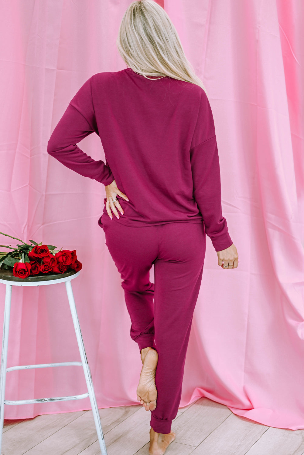 Red Heart Graphic Pullover and Drawstring Pants Lounge Set displayed on a mannequin, showcasing its cozy fabric and stylish heart design.