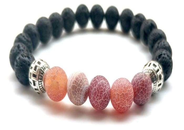 A stylish Red Lava Stone Essential Oil Bracelet showcasing natural lava stones, perfect for aromatherapy.