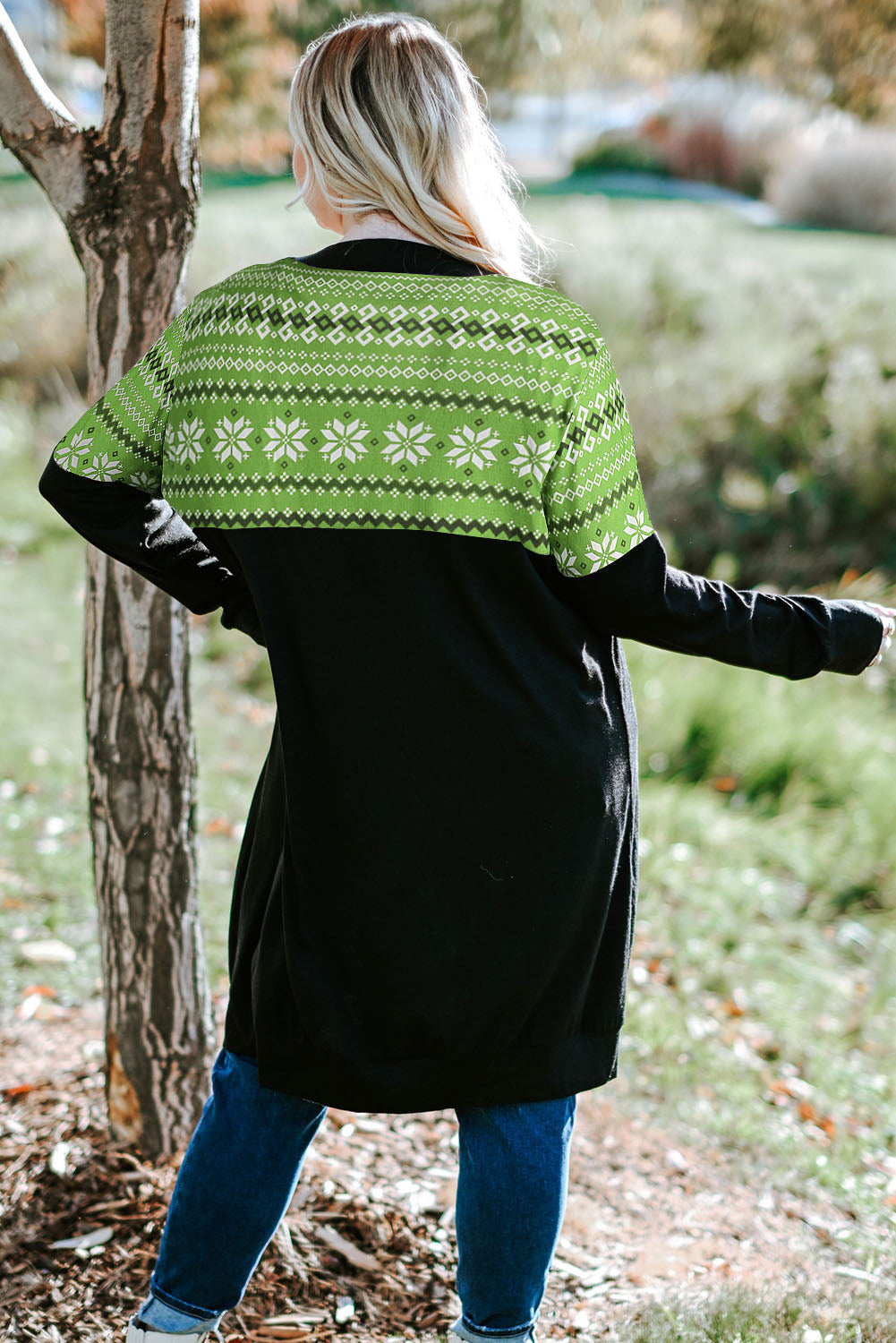 A stylish red plus size cardigan featuring leopard and plaid patchwork details, perfect for layering in cooler weather.