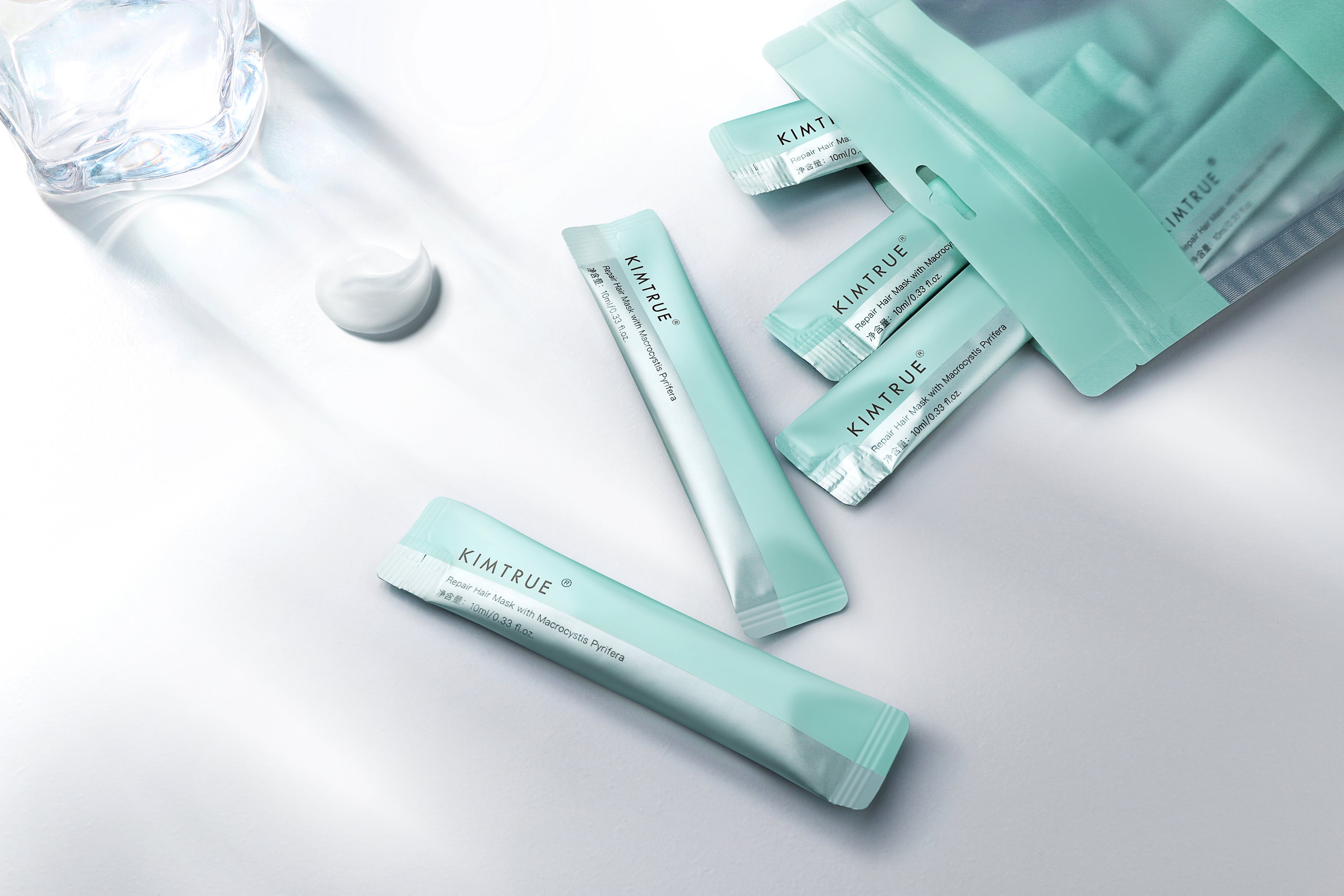 Kimtrue Repair Hair Mask with Macrocystis Pyrifera in individual 10ml sachets, designed for nourishing and repairing damaged hair.