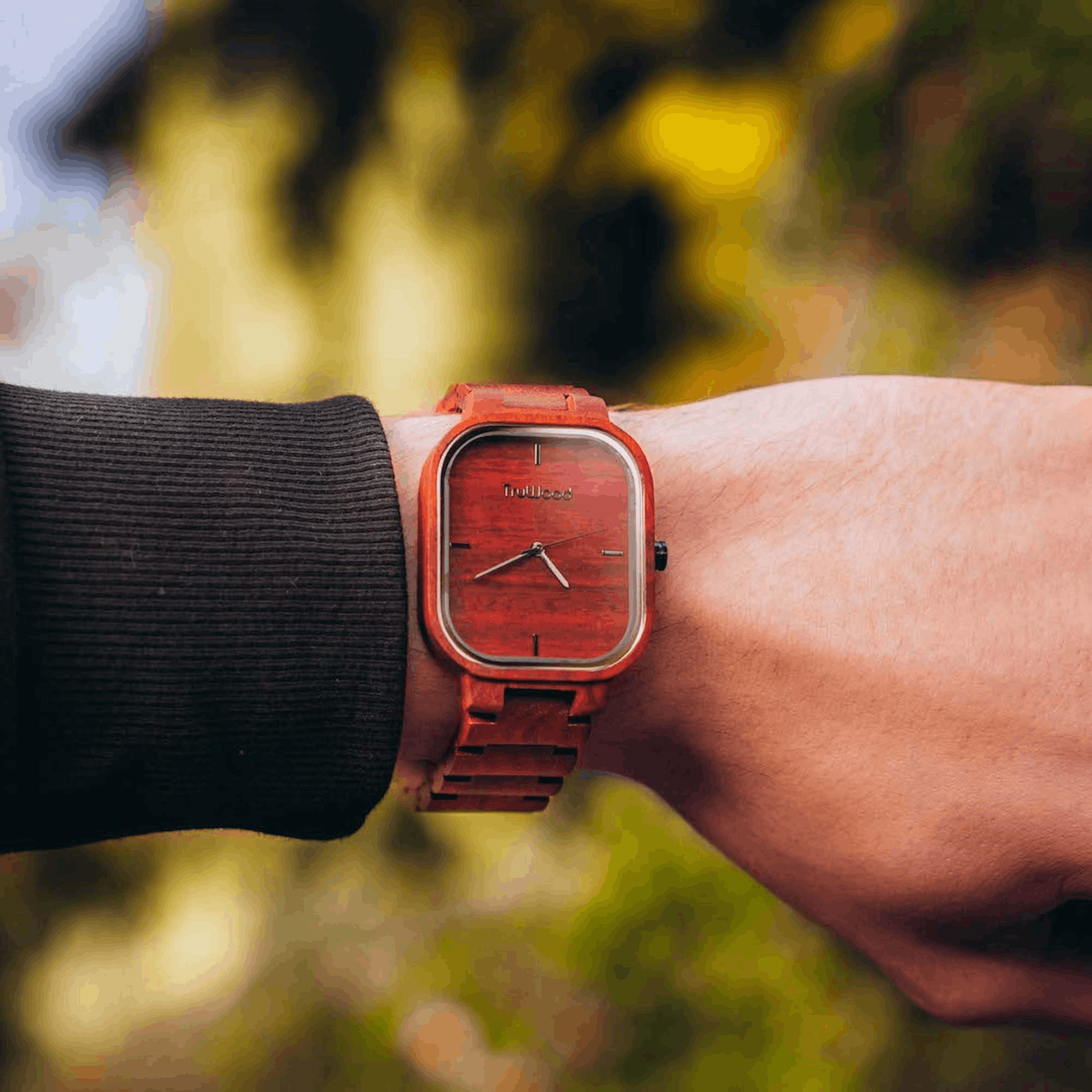TruWood Ridge Wrist Watch featuring a red sandalwood dial and black accents, showcasing its unique design and craftsmanship.