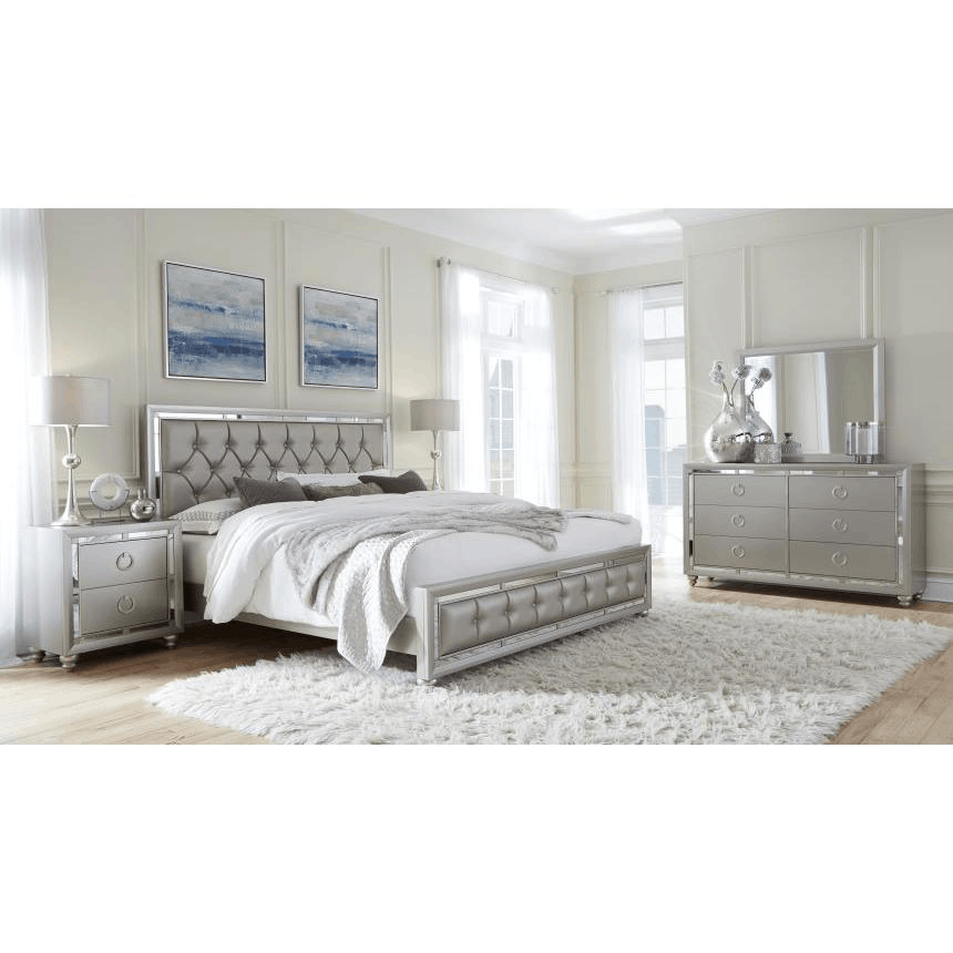 Riley Silver King Bed featuring a luxurious silver finish, tufted headboard, and elegant mirror accents.