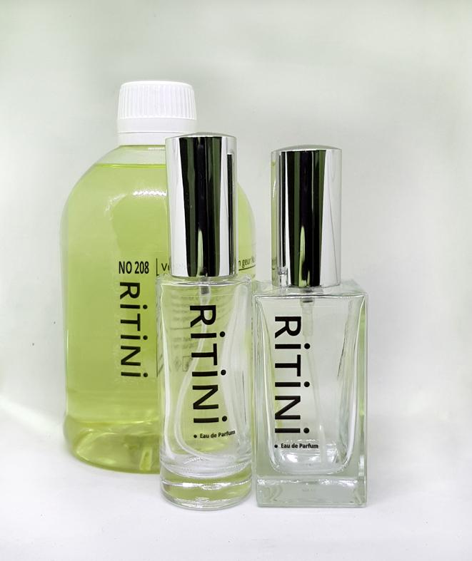 RiTiNi woman 404 Eau de Parfum 500 ml refill bottle with two empty perfume bottles, showcasing an elegant design and luxurious fragrance.