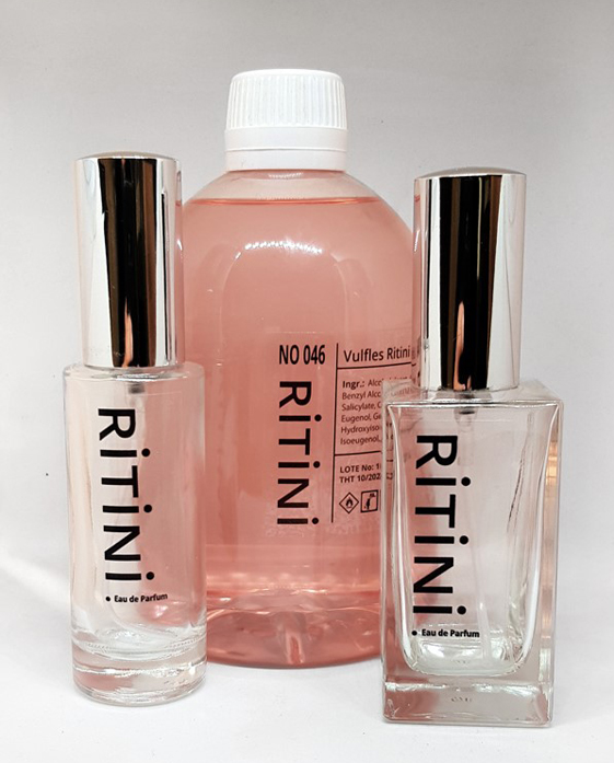 RiTiNi Woman 511 - SI PASSIONE fragrance with a 500 ml refill bottle and two empty perfume bottles, elegantly displayed.