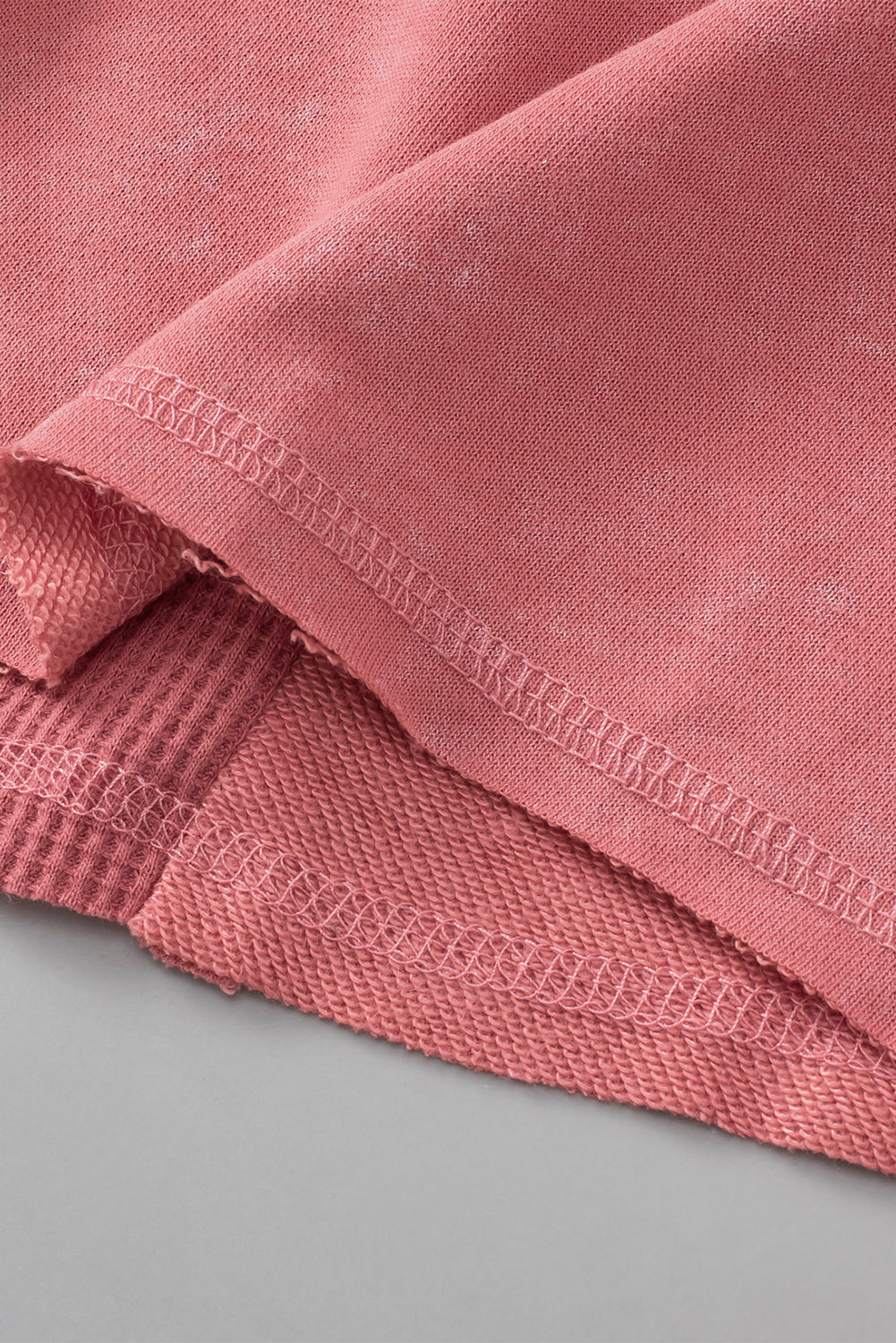 Rose Mineral Wash Patchwork Exposed Seam Sweatshirt featuring a retro design with exposed seams and a loose fit, made from fine terry fabric.