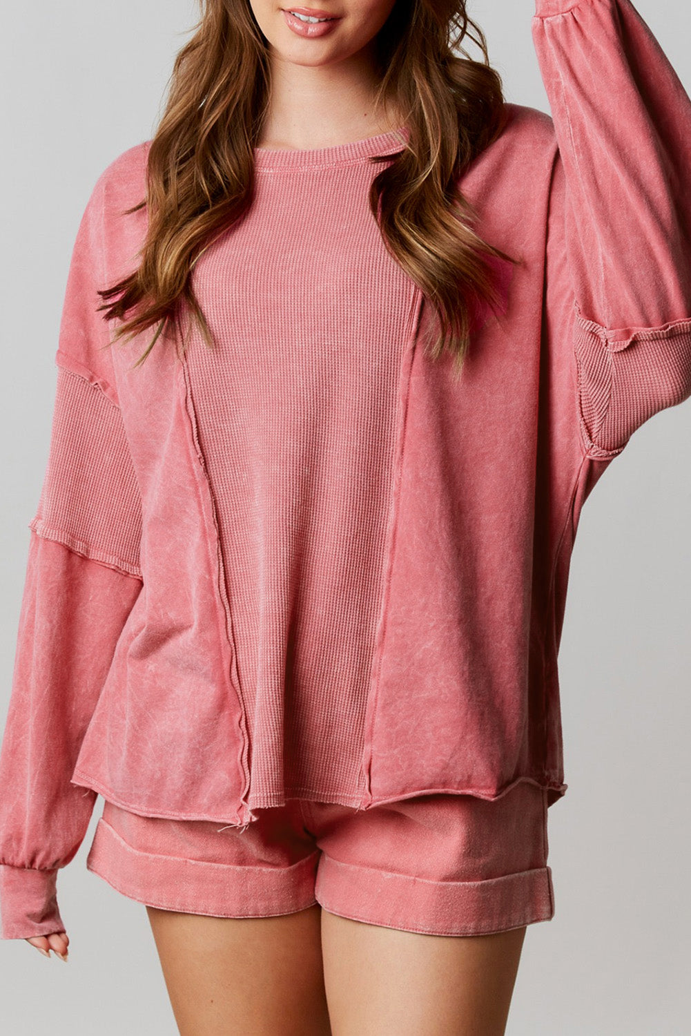 Rose Mineral Wash Patchwork Exposed Seam Sweatshirt featuring a retro design with exposed seams and a loose fit, made from fine terry fabric.