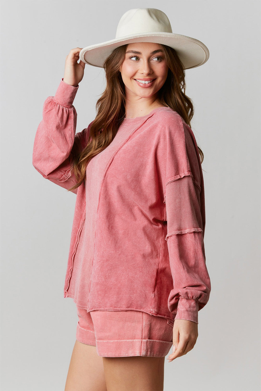 Rose Mineral Wash Patchwork Exposed Seam Sweatshirt featuring a retro design with exposed seams and a loose fit, made from fine terry fabric.