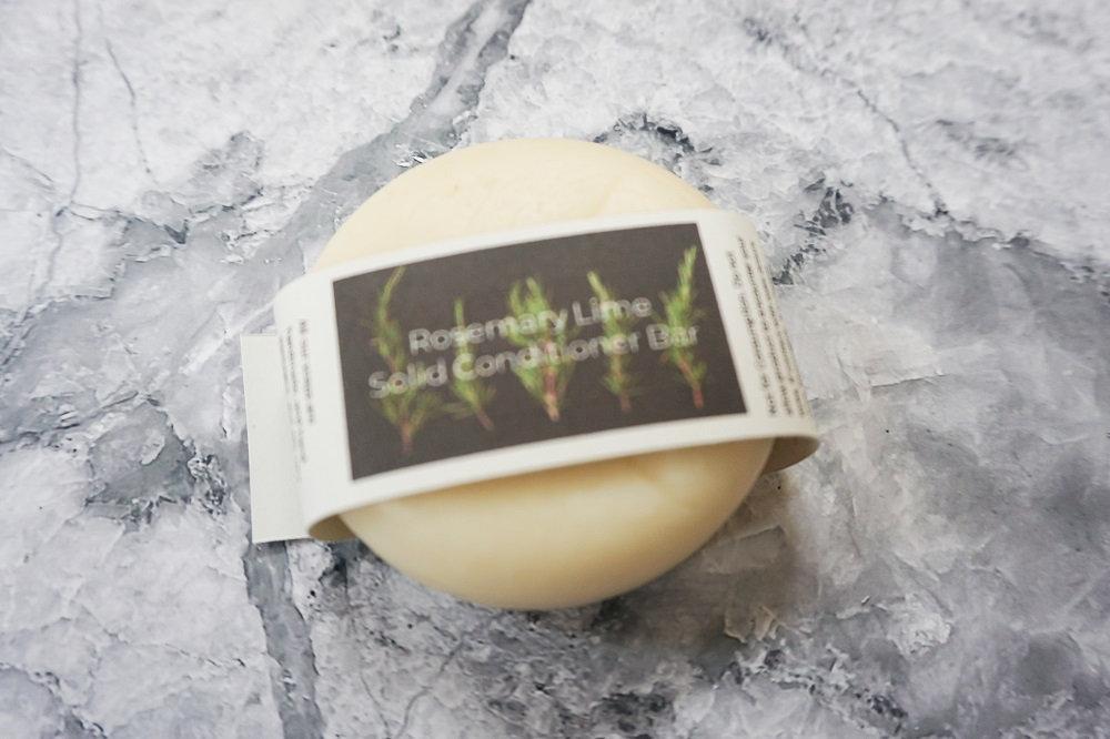 Rosemary and Lime Solid Conditioner bar, eco-friendly and plastic-free, featuring a unique design with natural ingredients.