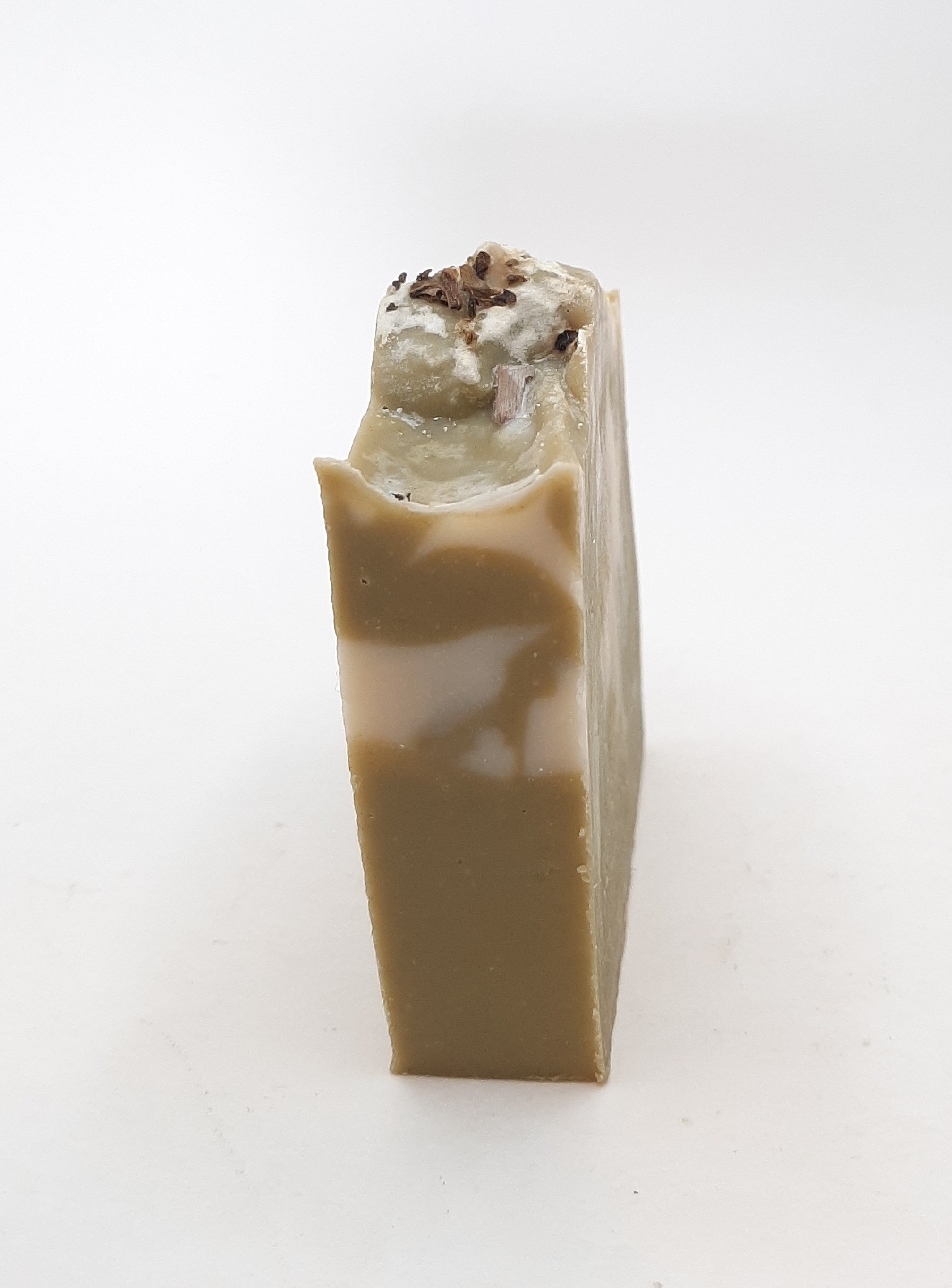 A beautifully crafted Rosemary & Mint Handmade Soap Bar, showcasing its natural colors and texture, perfect for refreshing skin care.