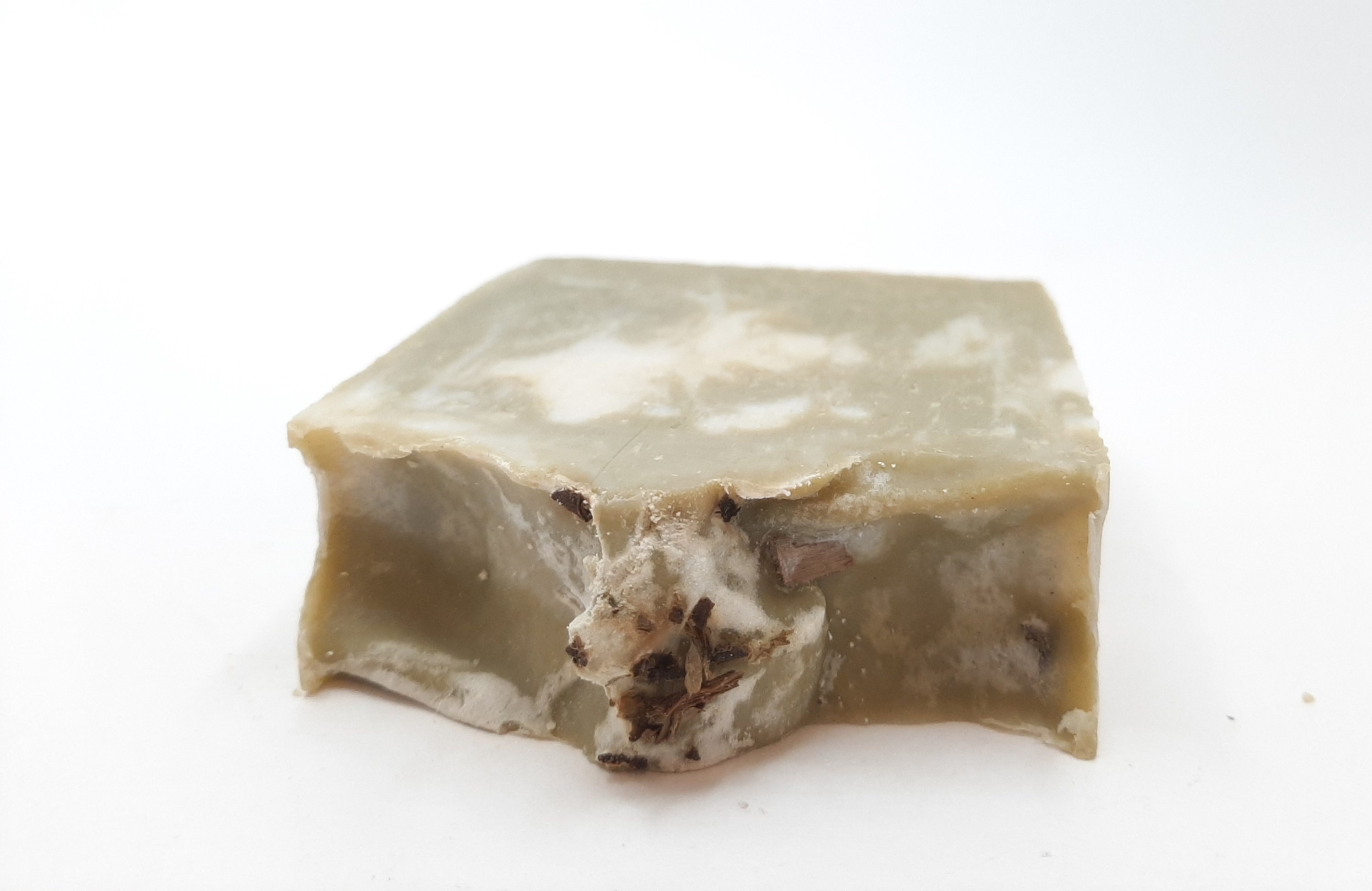 A beautifully crafted Rosemary & Mint Handmade Soap Bar, showcasing its natural colors and texture, perfect for refreshing skin care.