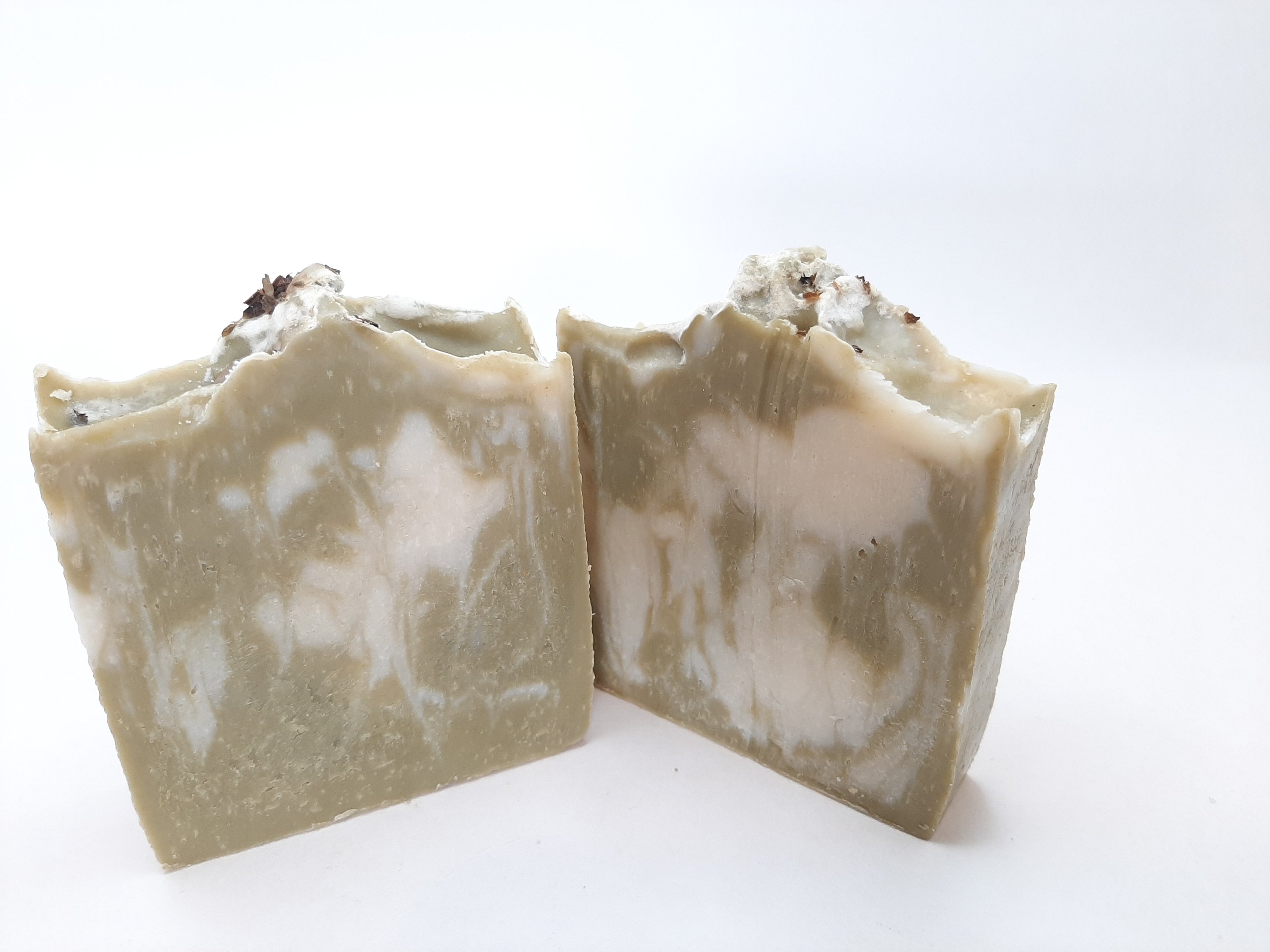 A beautifully crafted Rosemary & Mint Handmade Soap Bar, showcasing its natural colors and texture, perfect for refreshing skin care.
