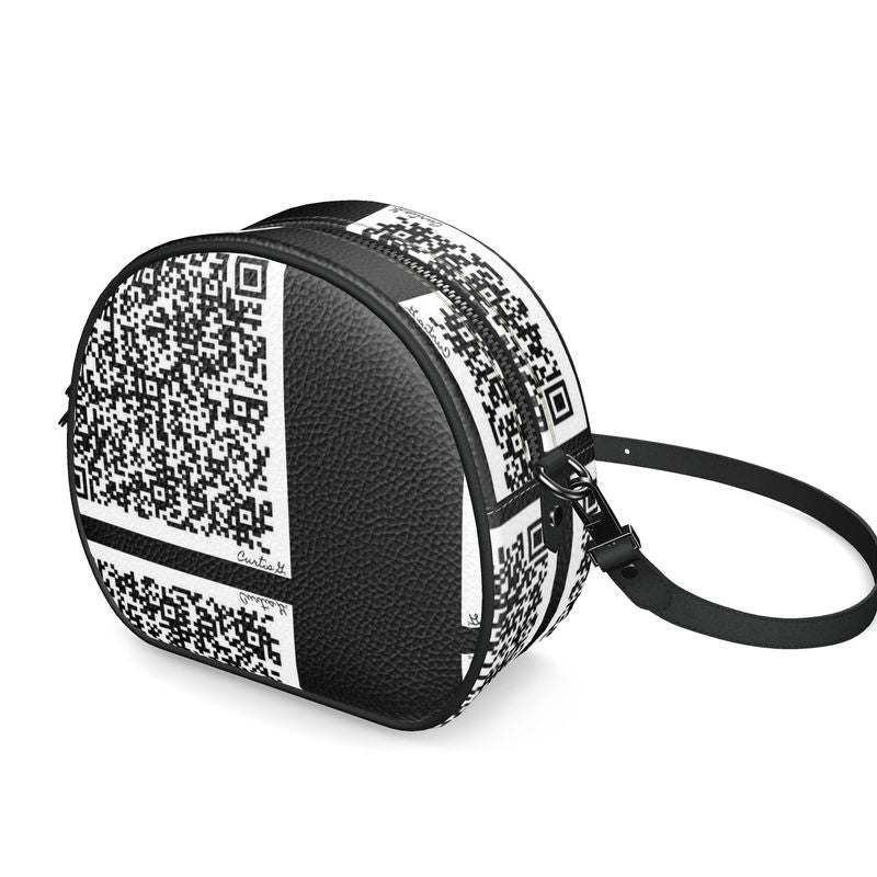 A stylish Round Box Bag made from 100% Nappa leather with faux suede lining and smooth black leather piping.