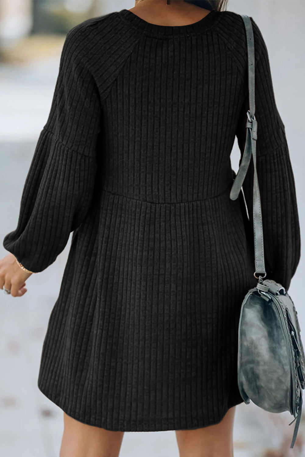 A stylish Round Neck Empire Waist Ribbed Knit Dress featuring a relaxed fit, ribbed texture, bubble sleeves, and side pockets.