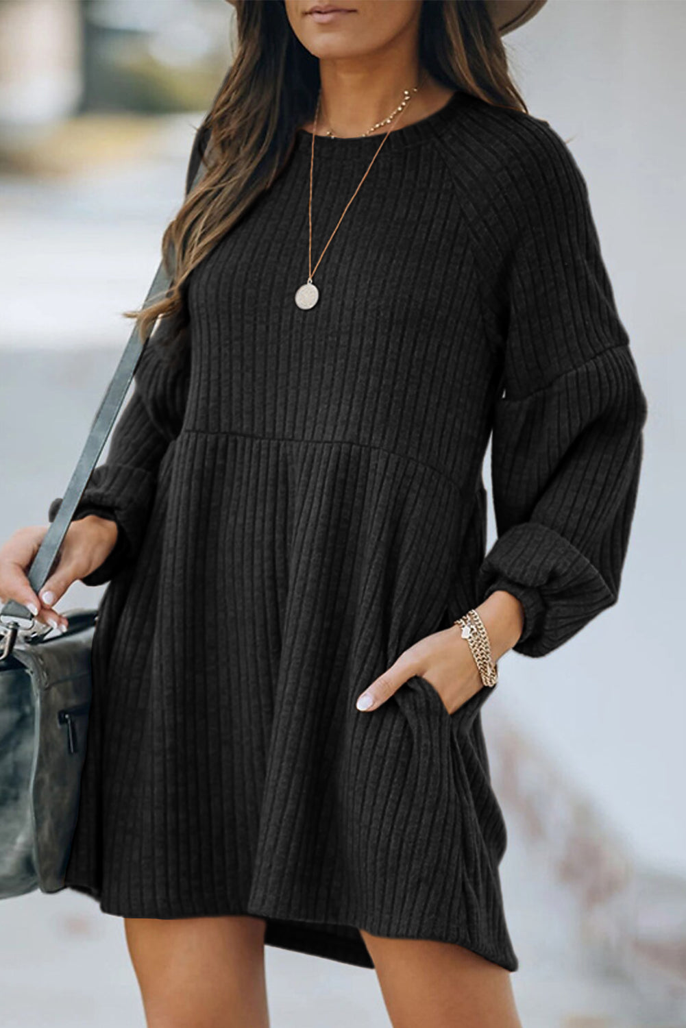 A stylish Round Neck Empire Waist Ribbed Knit Dress featuring a relaxed fit, ribbed texture, bubble sleeves, and side pockets.