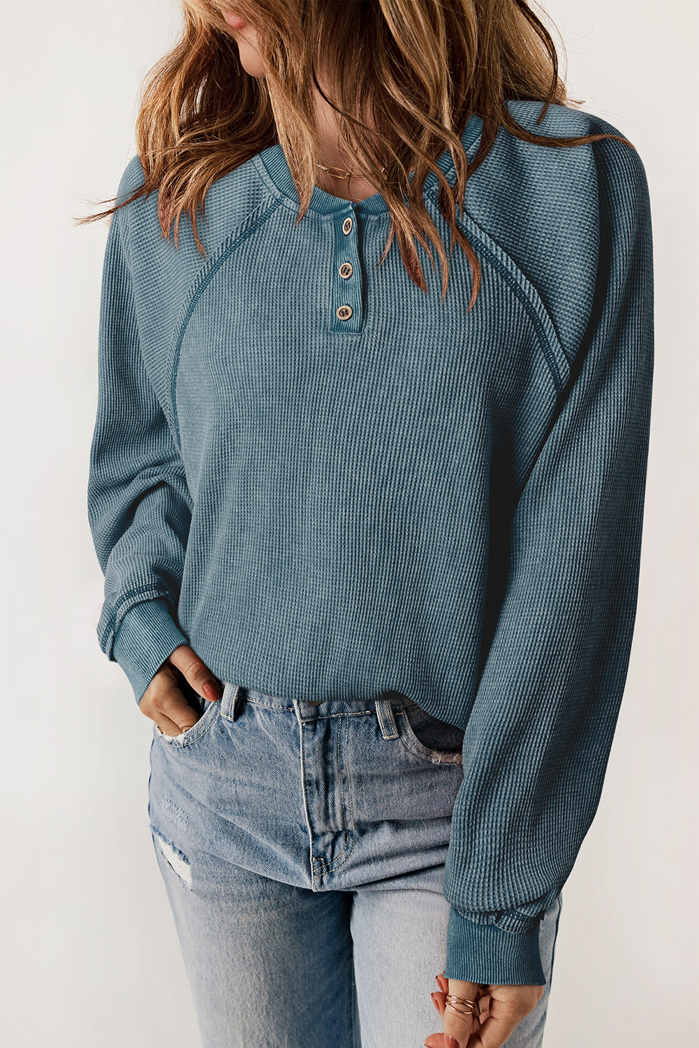 A stylish sea green waffle knit raglan sleeve Henley sweatshirt with button closure, showcasing a relaxed fit and ribbed trims.