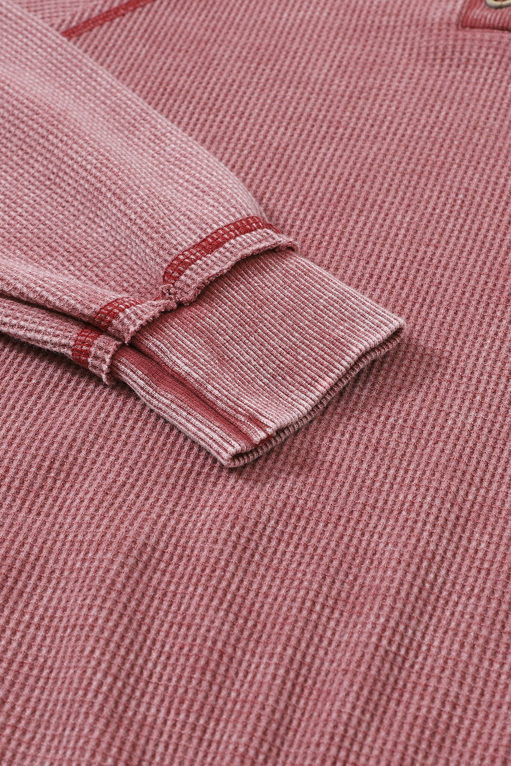 A stylish sea green waffle knit raglan sleeve Henley sweatshirt with button closure, showcasing a relaxed fit and ribbed trims.