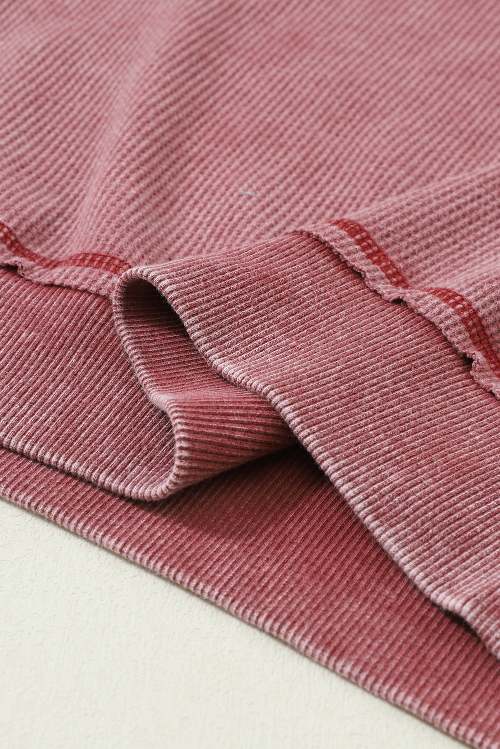 A stylish sea green waffle knit raglan sleeve Henley sweatshirt with button closure, showcasing a relaxed fit and ribbed trims.