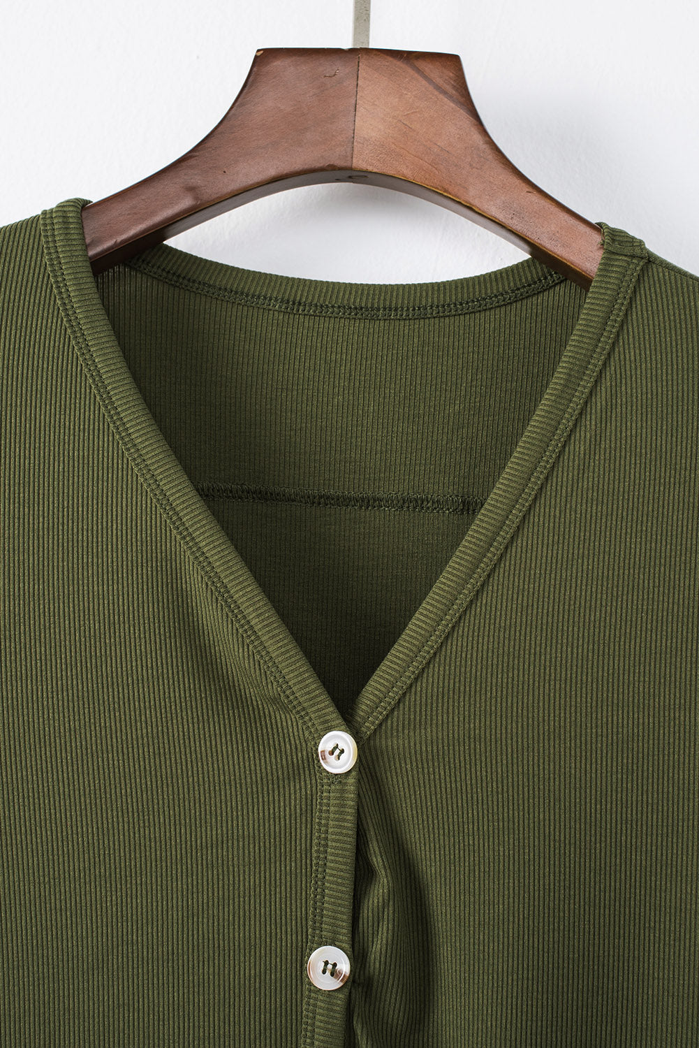 Selected Button Down Pocketed High Low Cardigan in a stylish design with button closure and side pockets, perfect for layering.