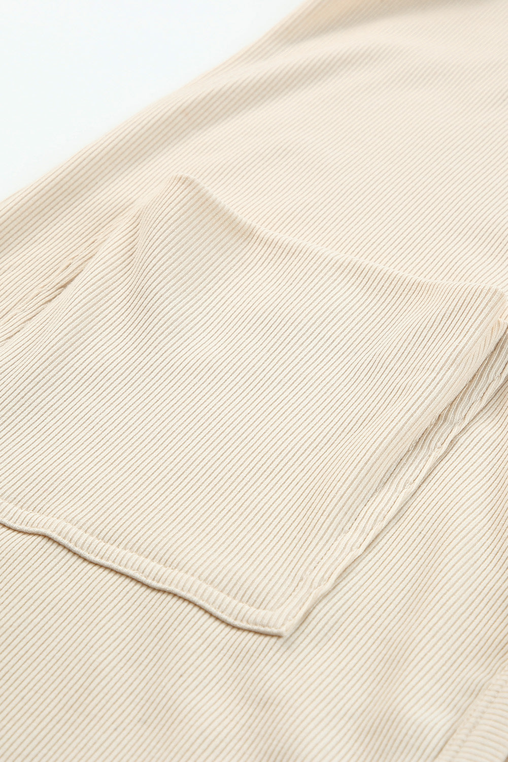 Selected Button Down Pocketed High Low Cardigan in a stylish design with button closure and side pockets, perfect for layering.