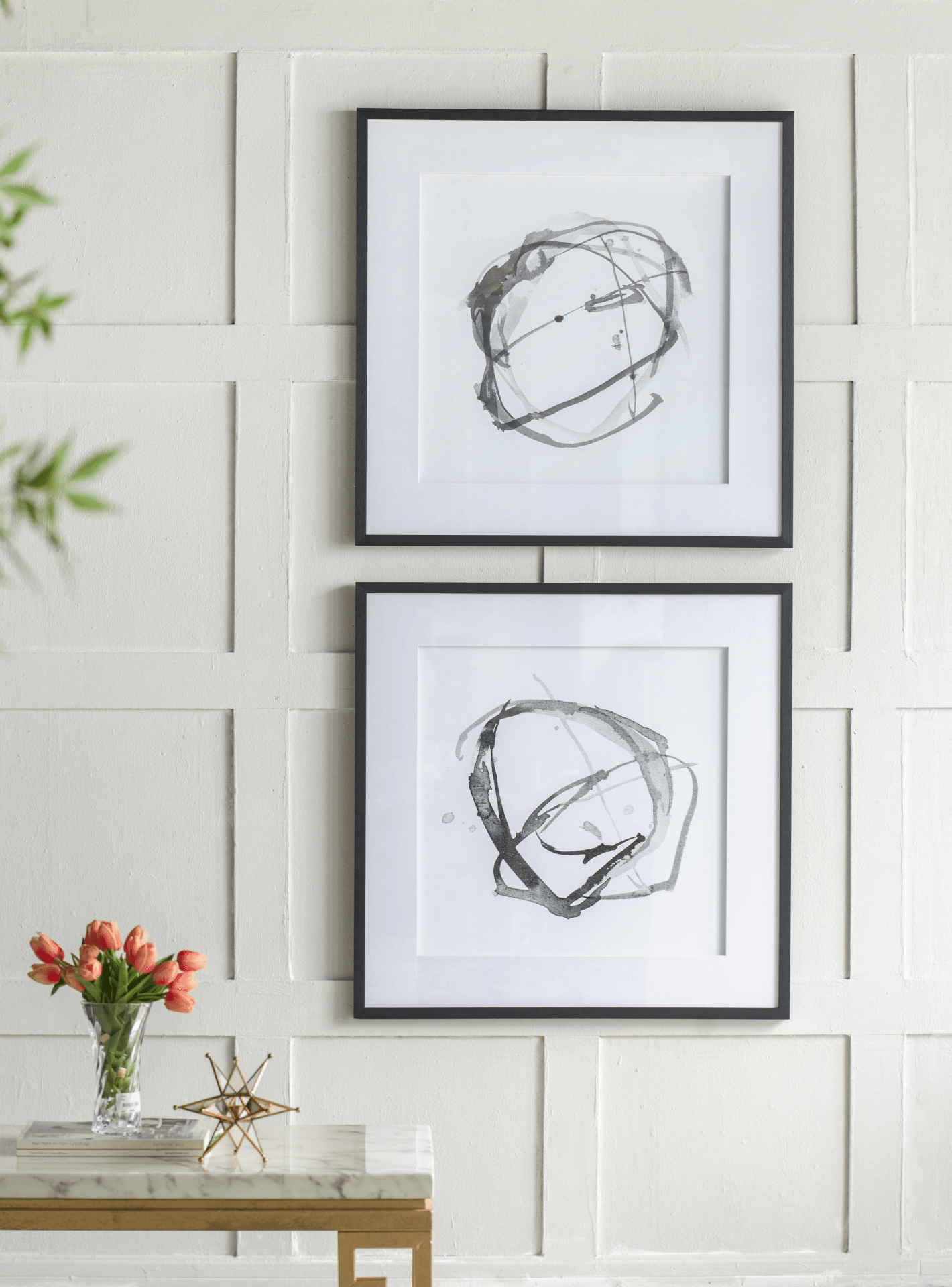Set of 2 modern abstract wall art prints framed in black, featuring contrasting shades of gray and white, measuring 31.5 inches square.