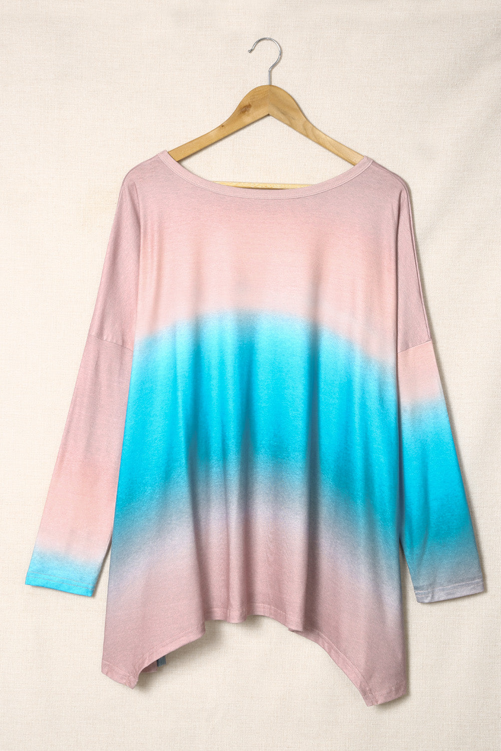 Sky Blue Plus Size Painted Poncho Top featuring a unique tie-dye print, round neck, drop shoulder, and long sleeves, designed for comfort and style.