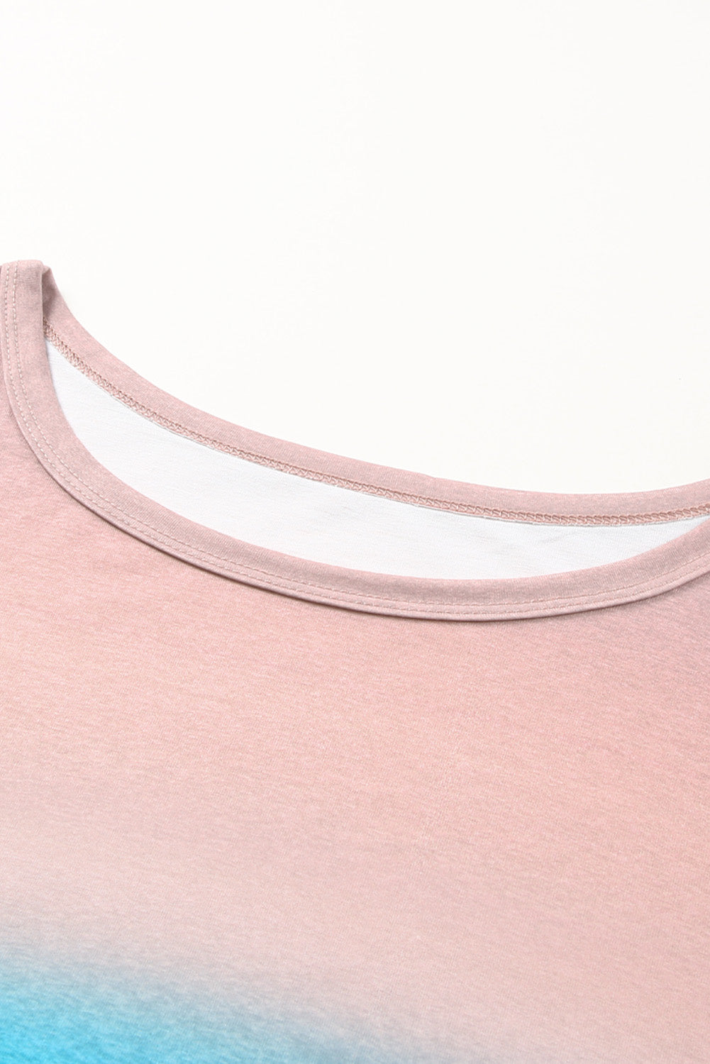 Sky Blue Plus Size Painted Poncho Top featuring a unique tie-dye print, round neck, drop shoulder, and long sleeves, designed for comfort and style.