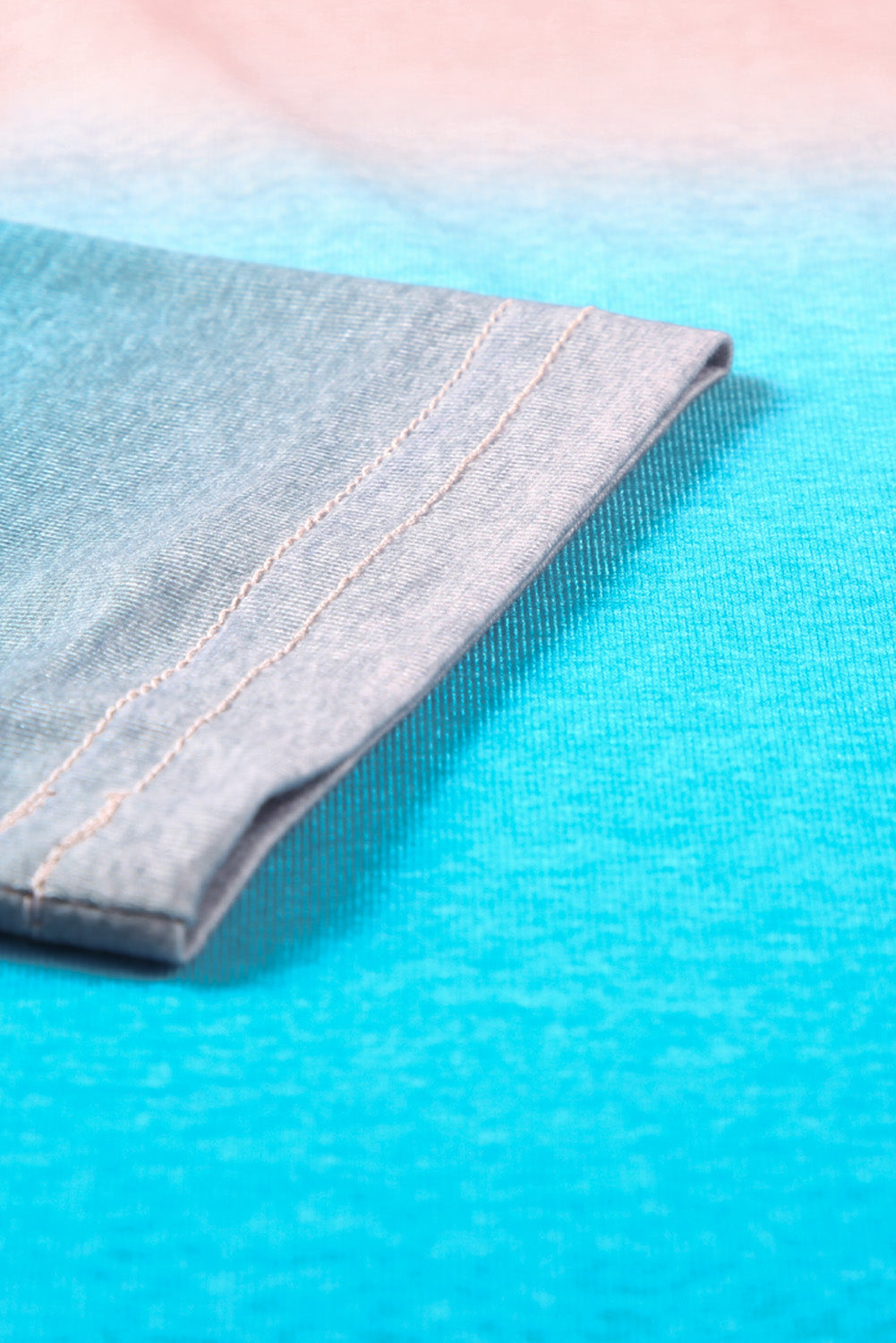 Sky Blue Plus Size Painted Poncho Top featuring a unique tie-dye print, round neck, drop shoulder, and long sleeves, designed for comfort and style.