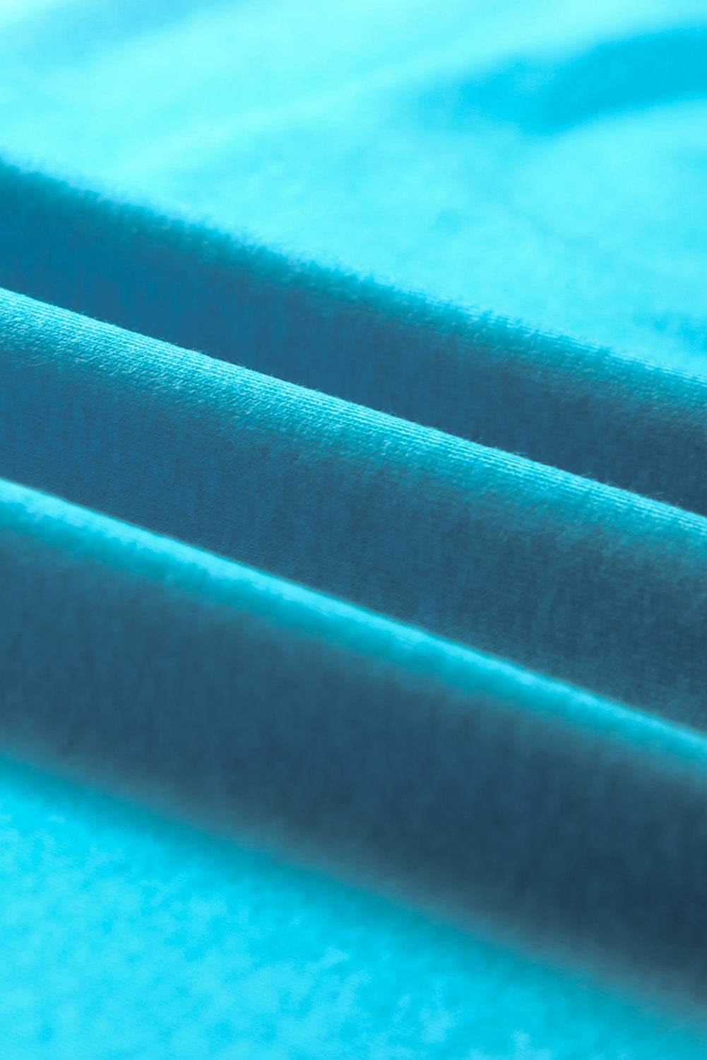 Sky Blue Plus Size Painted Poncho Top featuring a unique tie-dye print, round neck, drop shoulder, and long sleeves, designed for comfort and style.