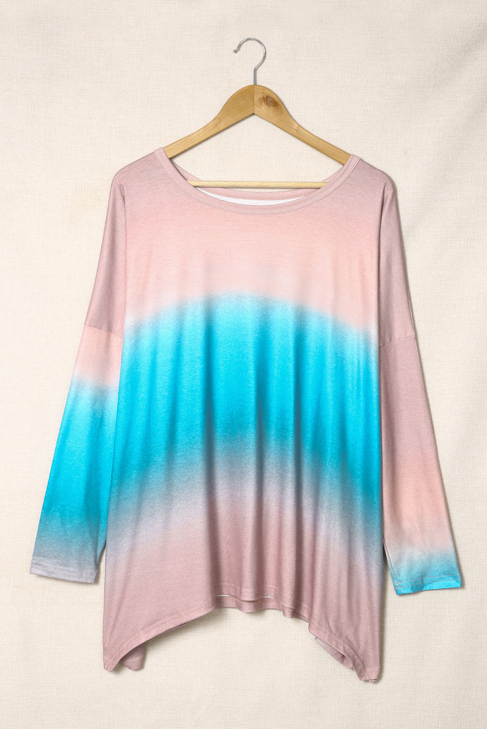 Sky Blue Plus Size Painted Poncho Top featuring a unique tie-dye print, round neck, drop shoulder, and long sleeves, designed for comfort and style.